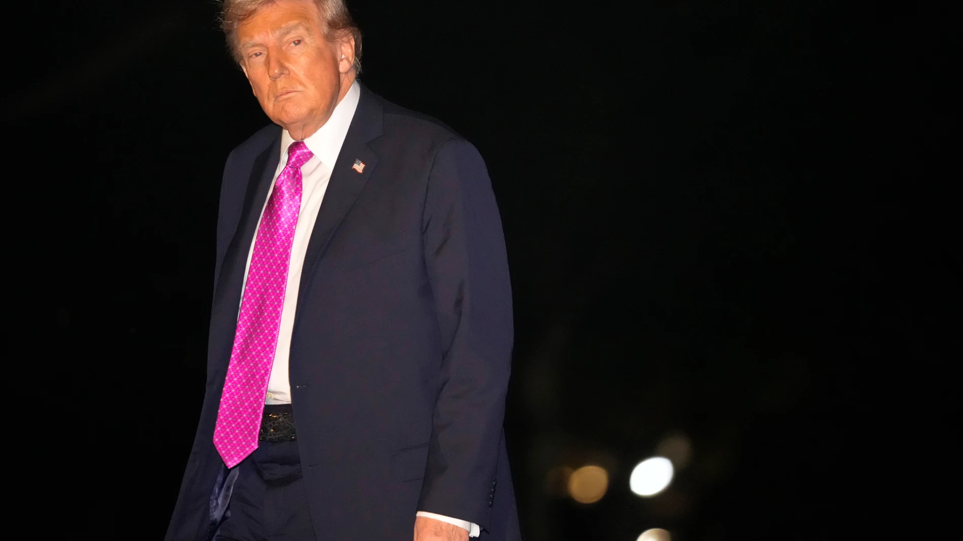 President Donald Trump walks across the South Lawn of the White House, Sunday, Sept. 14, 2025, in Washington, after returning from a trip to New York and New Jersey. (AP Photo/Mark Schiefelbein)
