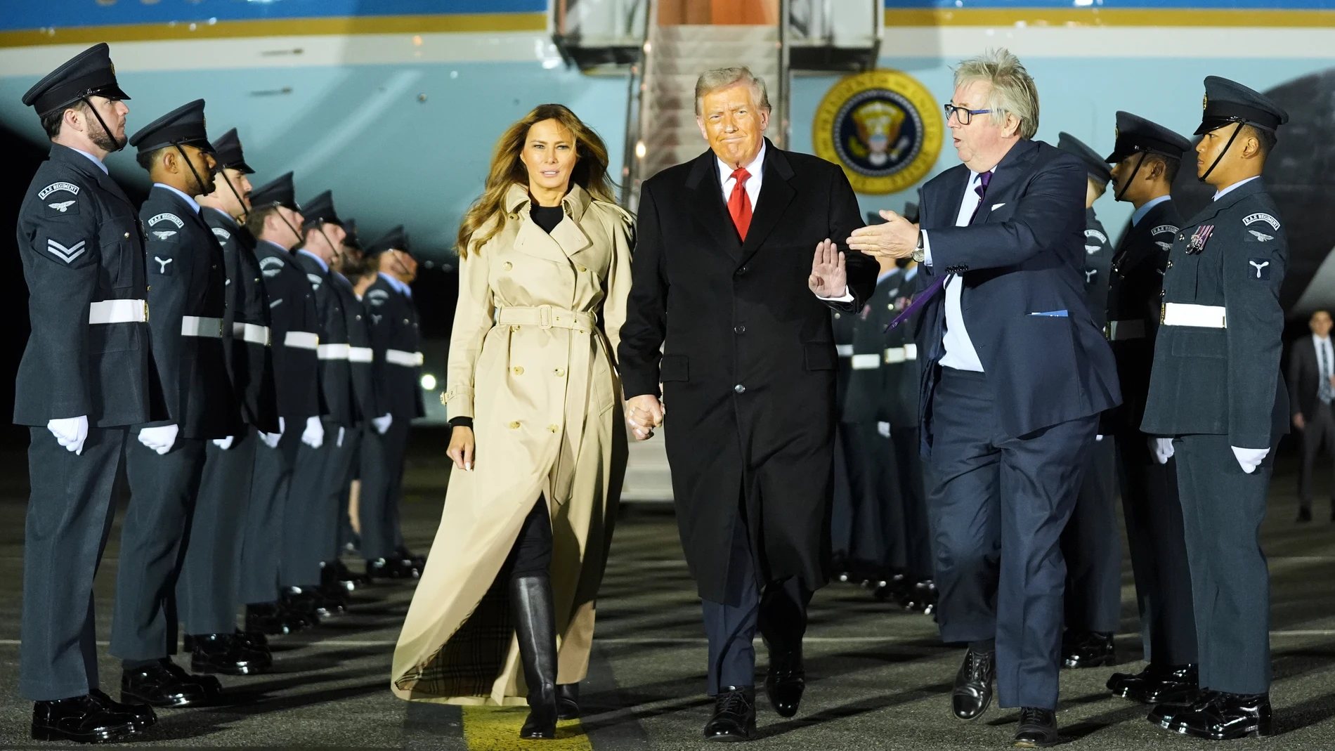 President Donald Trump and first lady Melania Trump are greeted by The Viscount Hood, Lord-in-Waiting, center-right, as they arrive at Stansted Airport near London, Tuesday, Sept. 16, 2025. (AP Photo/Evan Vucci)