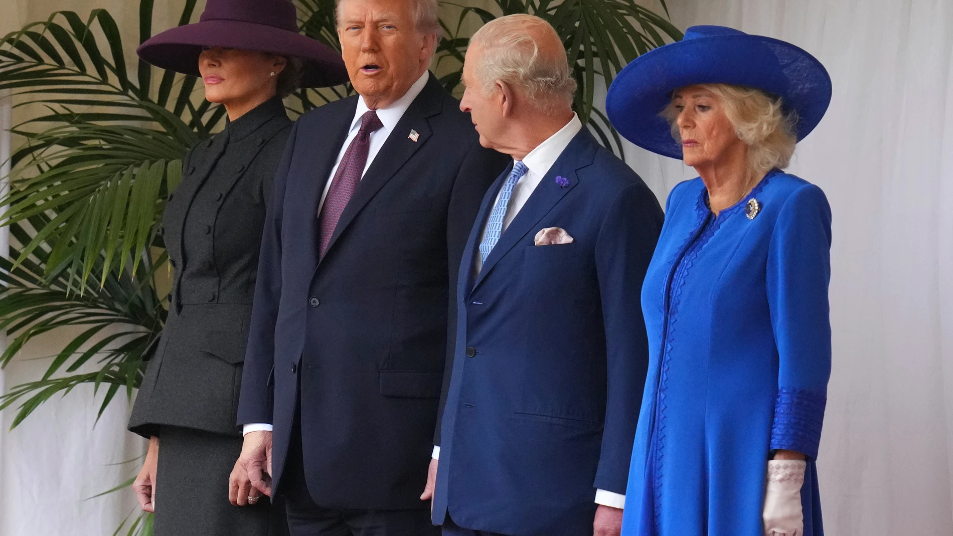 President Donald Trump, Britain's King Charles III, Queen Camilla and Melania Trump on the left wait to review the Guard of Honour at Windsor Castle in Windsor, England, Wednesday, Sept. 17, 2025.(AP Photo/Kirsty Wigglesworth, Pool)