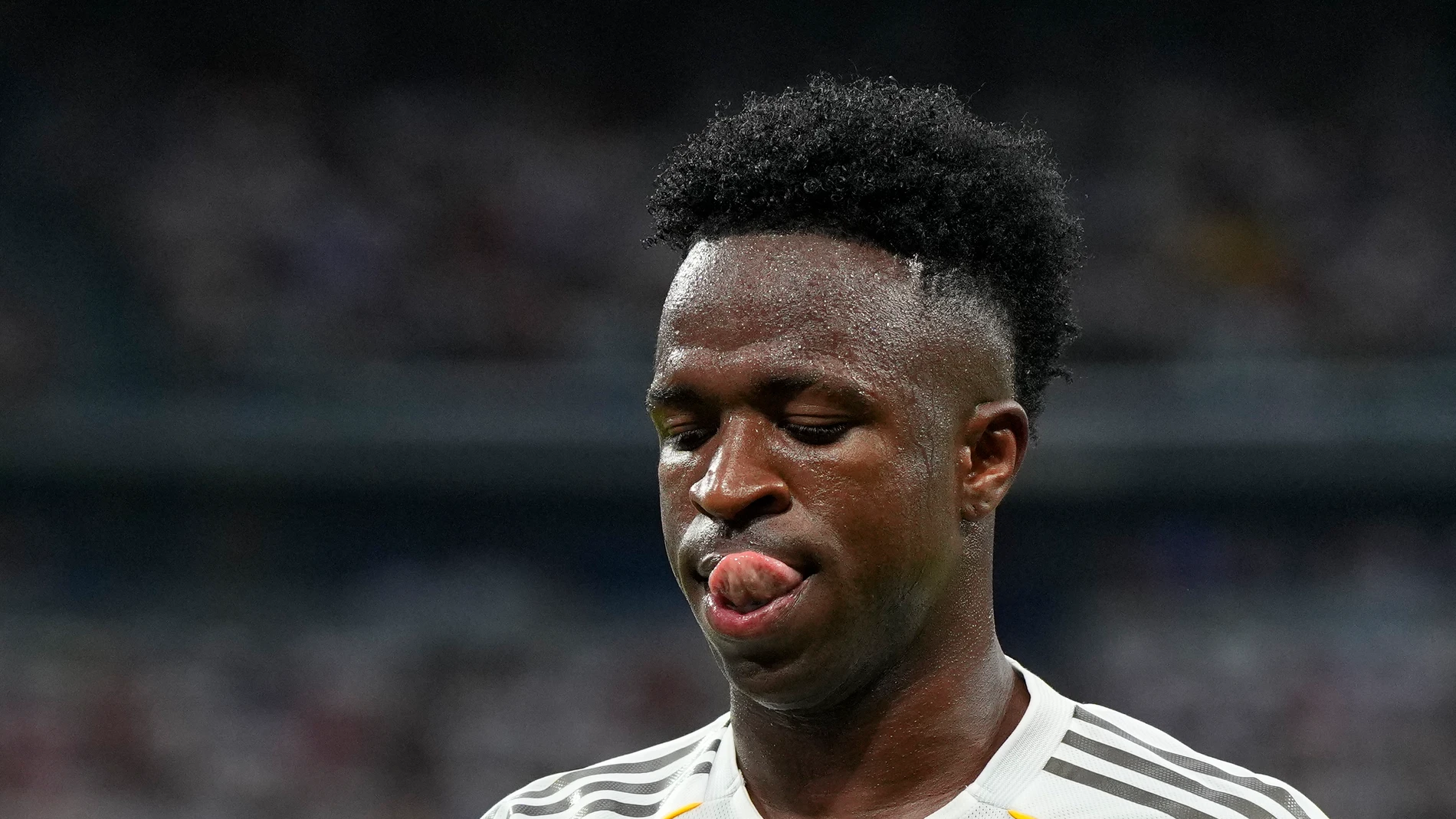 Real Madrid's Vinicius Junior reacts during the Spanish La Liga soccer match between Real Madrid and Espanyol at the Santiago Bernabeu stadium in Madrid, Spain, Saturday, Sept. 20, 2025. (AP Photo/Manu Fernandez)