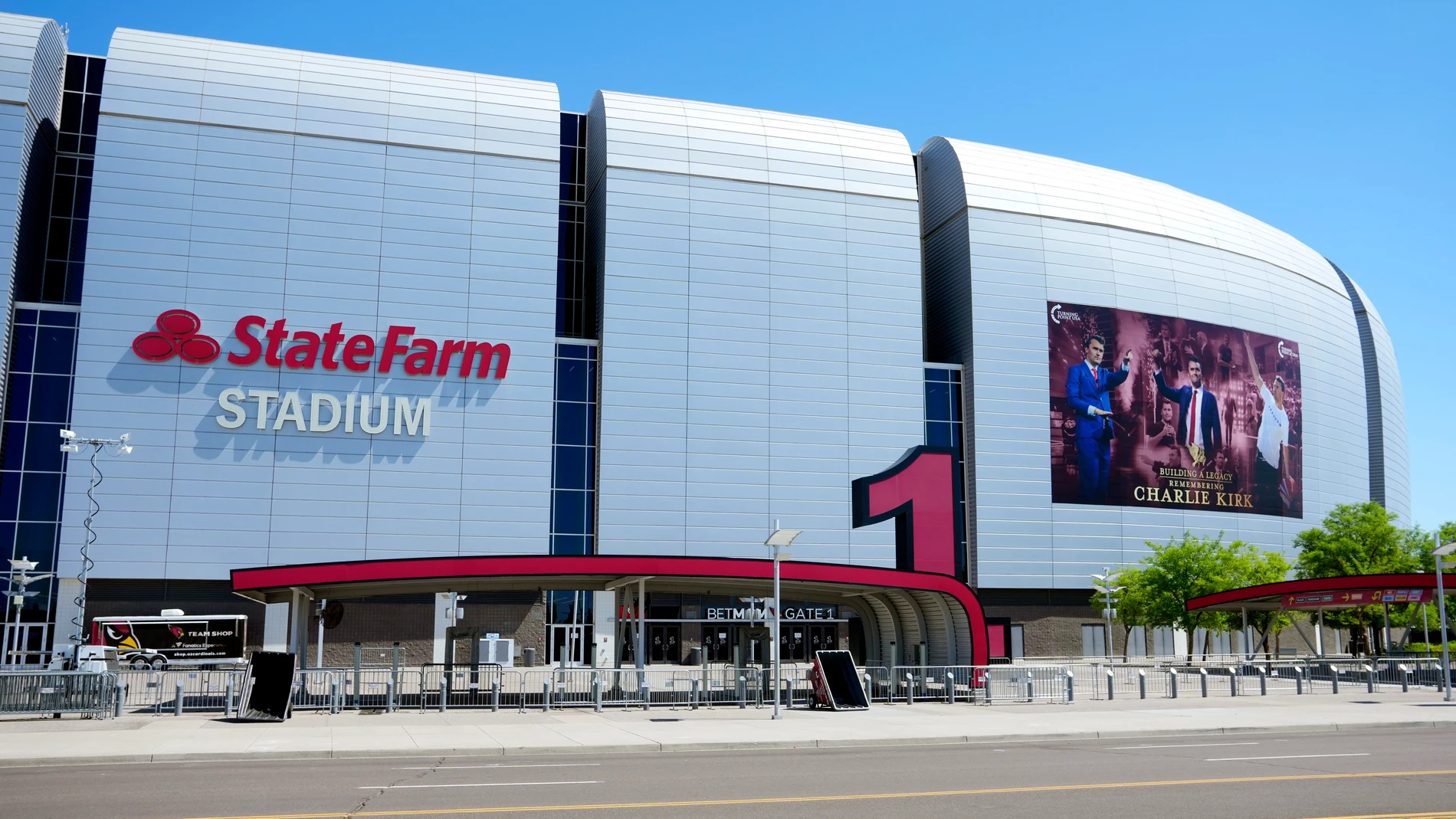 A large banner is installed prior to the Charlie Kirk memorial services at State Farm Stadium Saturday, Sept. 20, 2025, in Glendale, Ariz. (AP Photo/Ross D. Franklin)