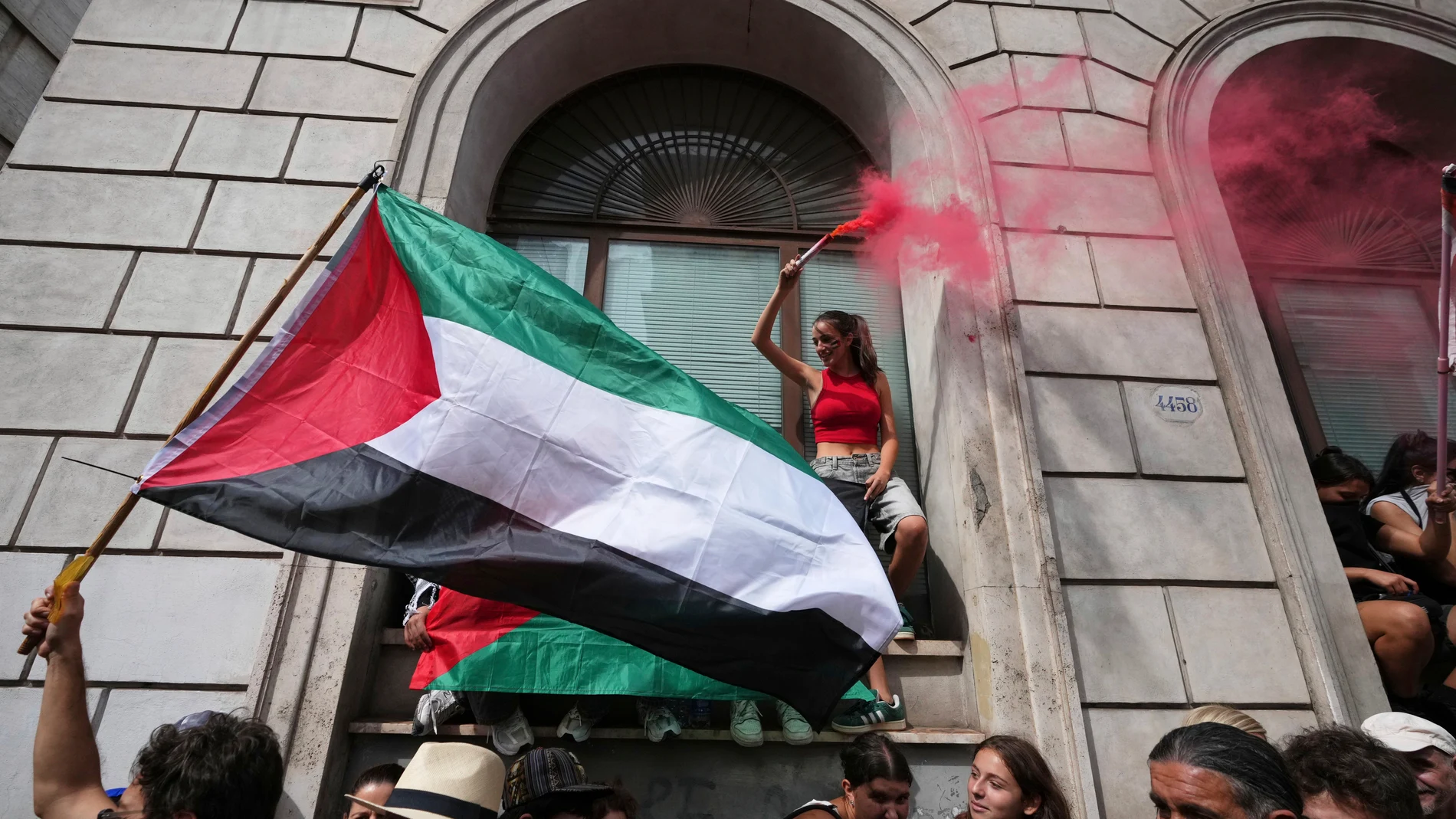 People hold Palestinian flags as they participate in a demonstration part of a nation-wide protest and general strike against the war in Gaza, in Rome, Monday, Sept. 22, 2025. (AP Photo/Alessandra Tarantino)