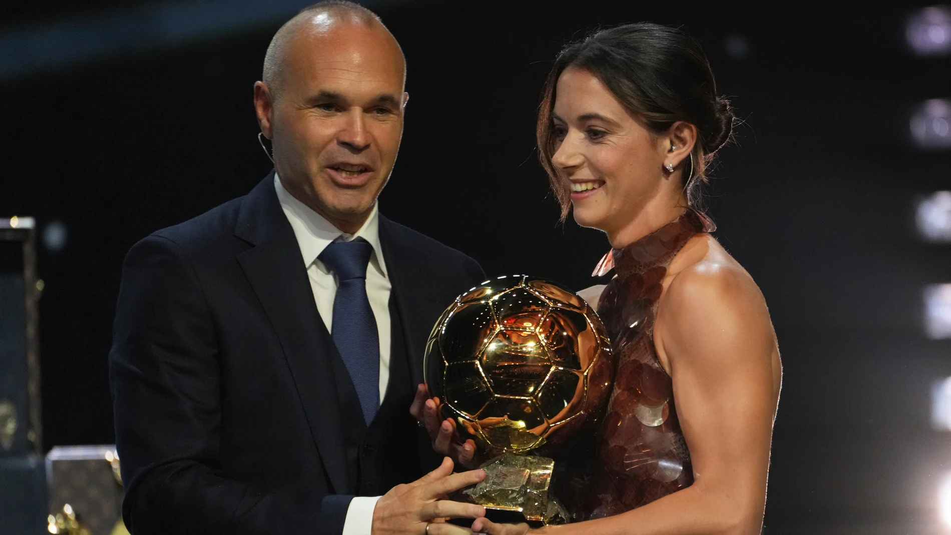 Barcelona's Aitana Bonmatí receives from Andres Iniesta the 2025 Women's Ballon d'Or during the 69th Ballon d'Or awards ceremony at the Theatre du Chatelet in Paris, Monday, Sept. 22, 2025. (AP Photo/Thibault Camus)