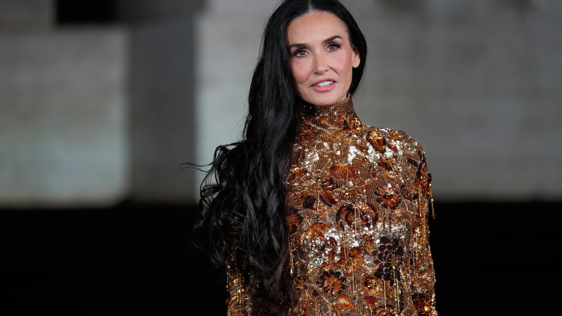 Demi Moore arrives for the premiere of the short film "The Tiger," directed by Spike Jonze and Halina Reijn, featuring the first looks by Gucci's new creative director, Demna, in Milan, northern Italy, Tuesday, Sept. 23, 2025. (AP Photo/Luca Bruno)