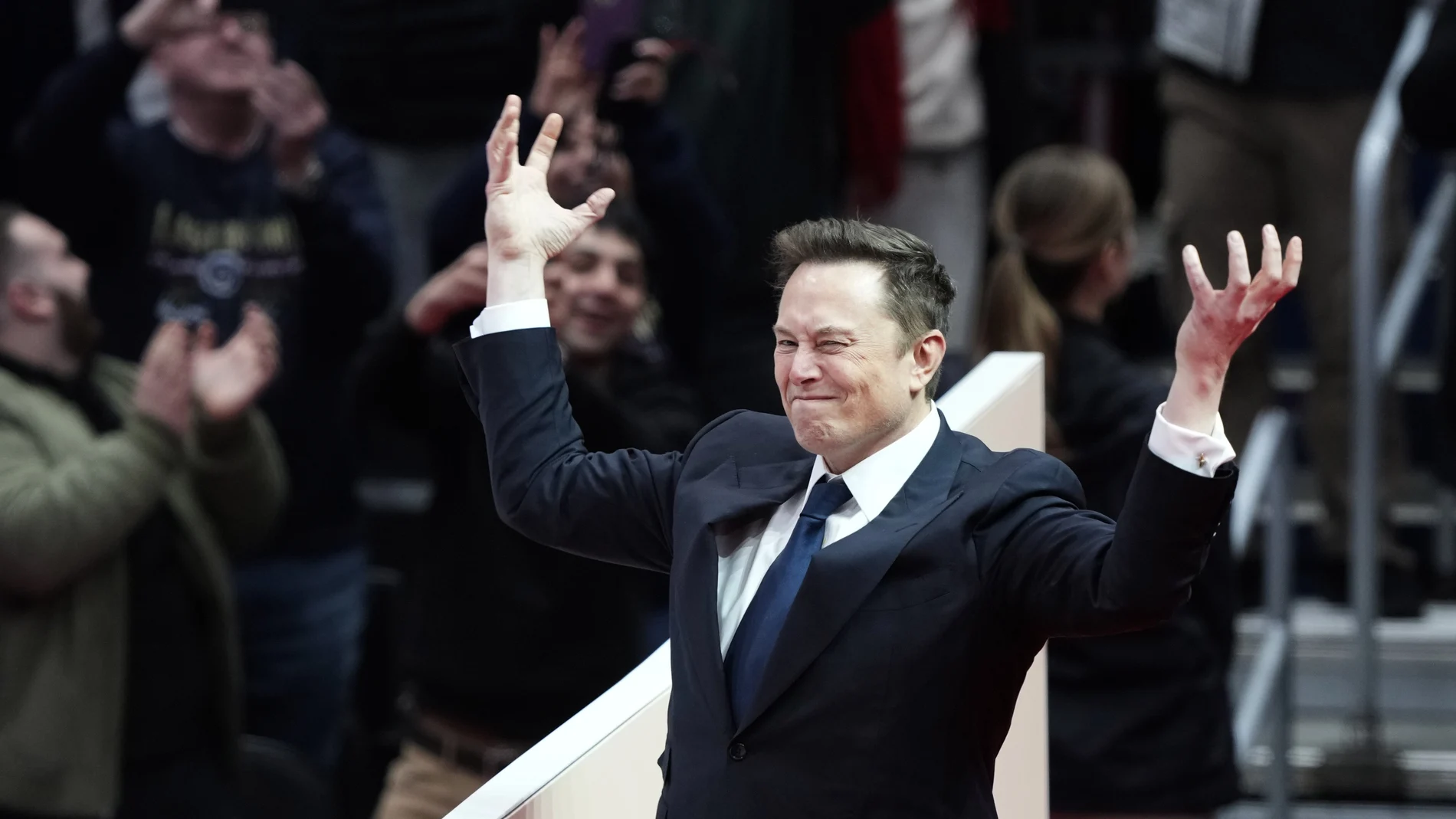 Elon Musk arrives on stage to speak at an indoor Presidential Inauguration parade event in Washington, Monday, Jan. 20, 2025. (AP Photo/Susan Walsh)