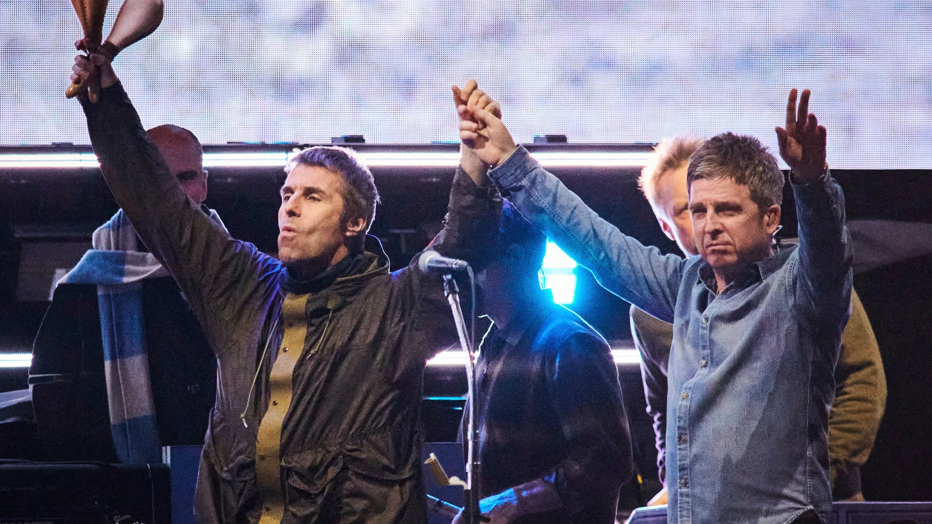 FILE - Liam Gallagher, left, and Noel Gallagher of Oasis walk onstage together during their reunion tour in Toronto, Sunday, Aug. 24, 2025. (Sammy Kogan/The Canadian Press via AP, File)