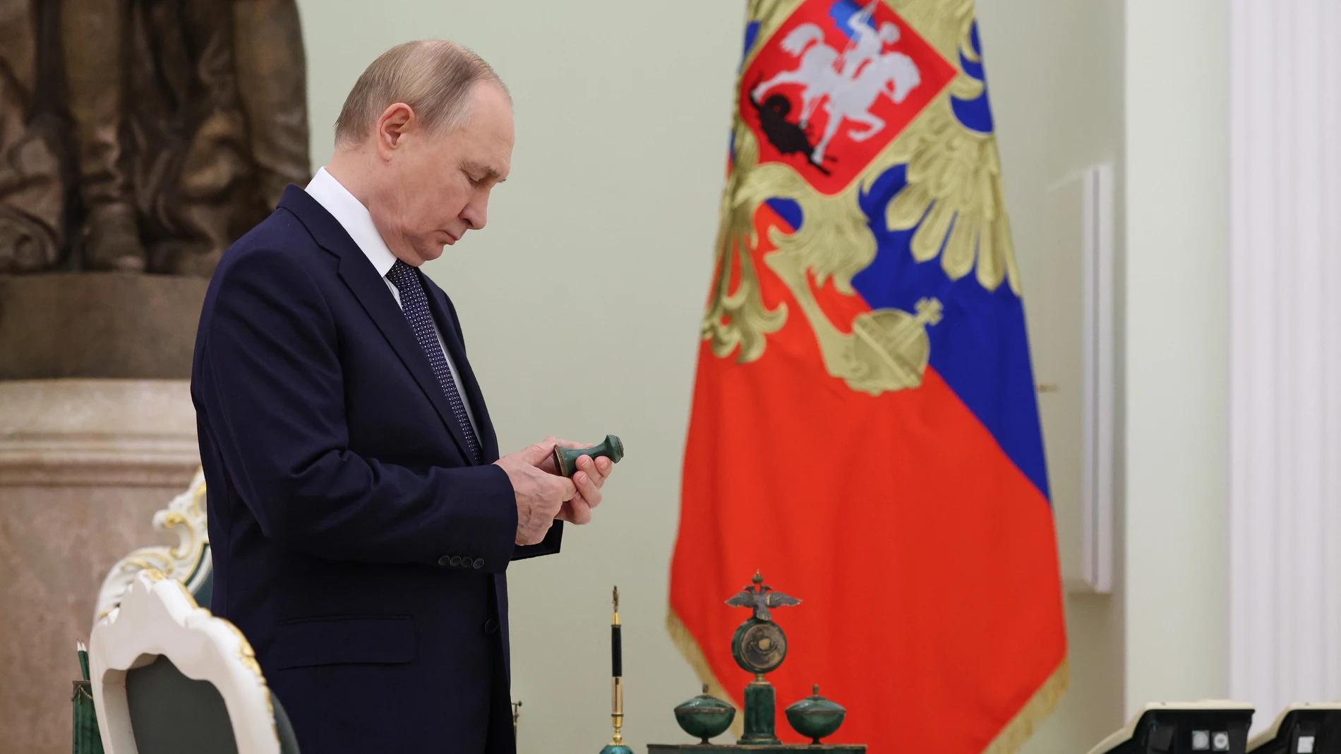 Russian President Vladimir Putin waits for the arrival of Belarusian President Alexander Lukashenko before their meeting at the Kremlin in Moscow, Russia, Friday, Sept. 26, 2025. (Ramil Sitdikov/Pool Photo via AP)