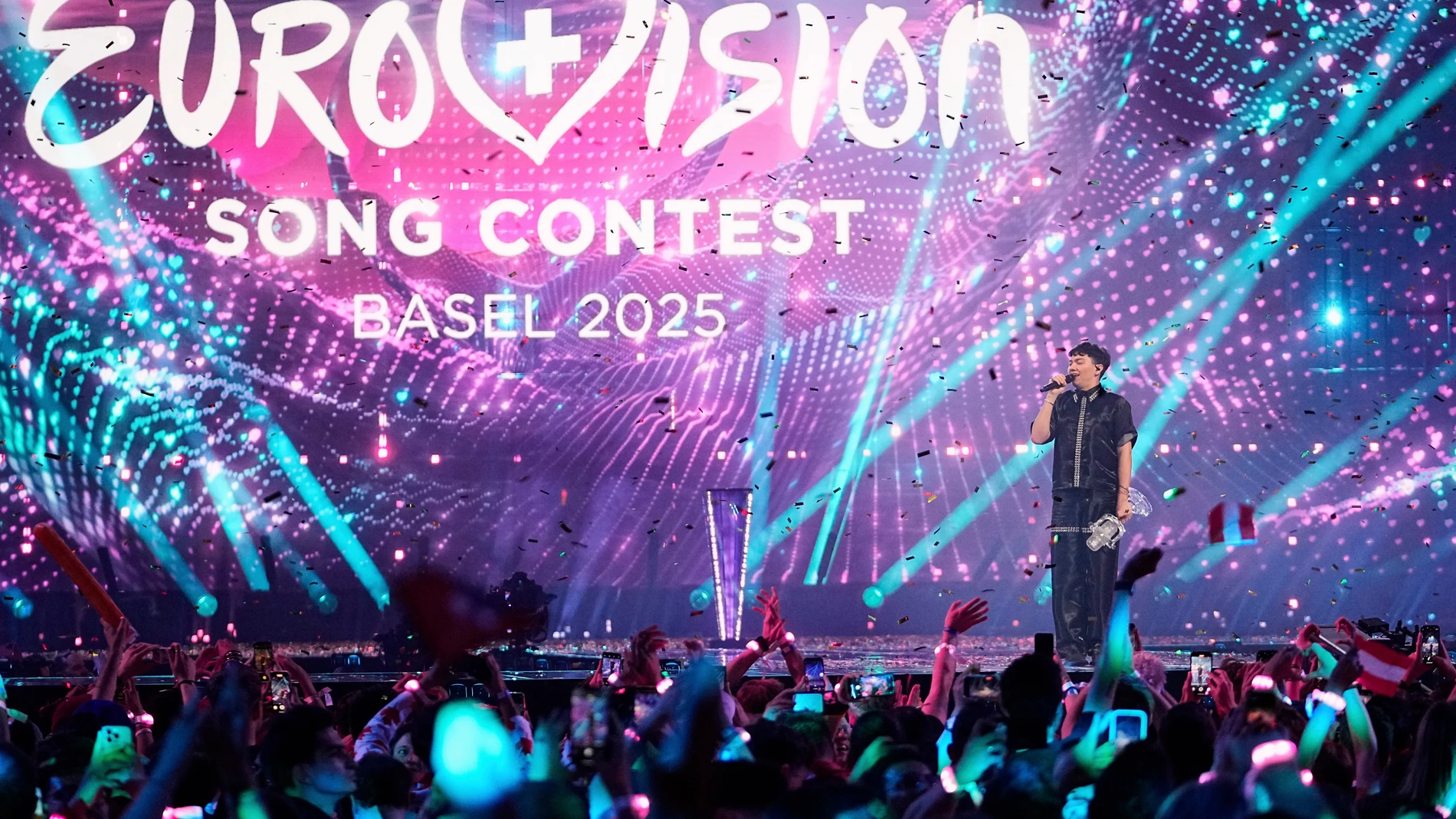 FILE - JJ from Austria stands on the stage with the trophy after winning the Grand Final of the 69th Eurovision Song Contest, in Basel, Switzerland, May 18, 2025. (AP Photo/Martin Meissner, File)