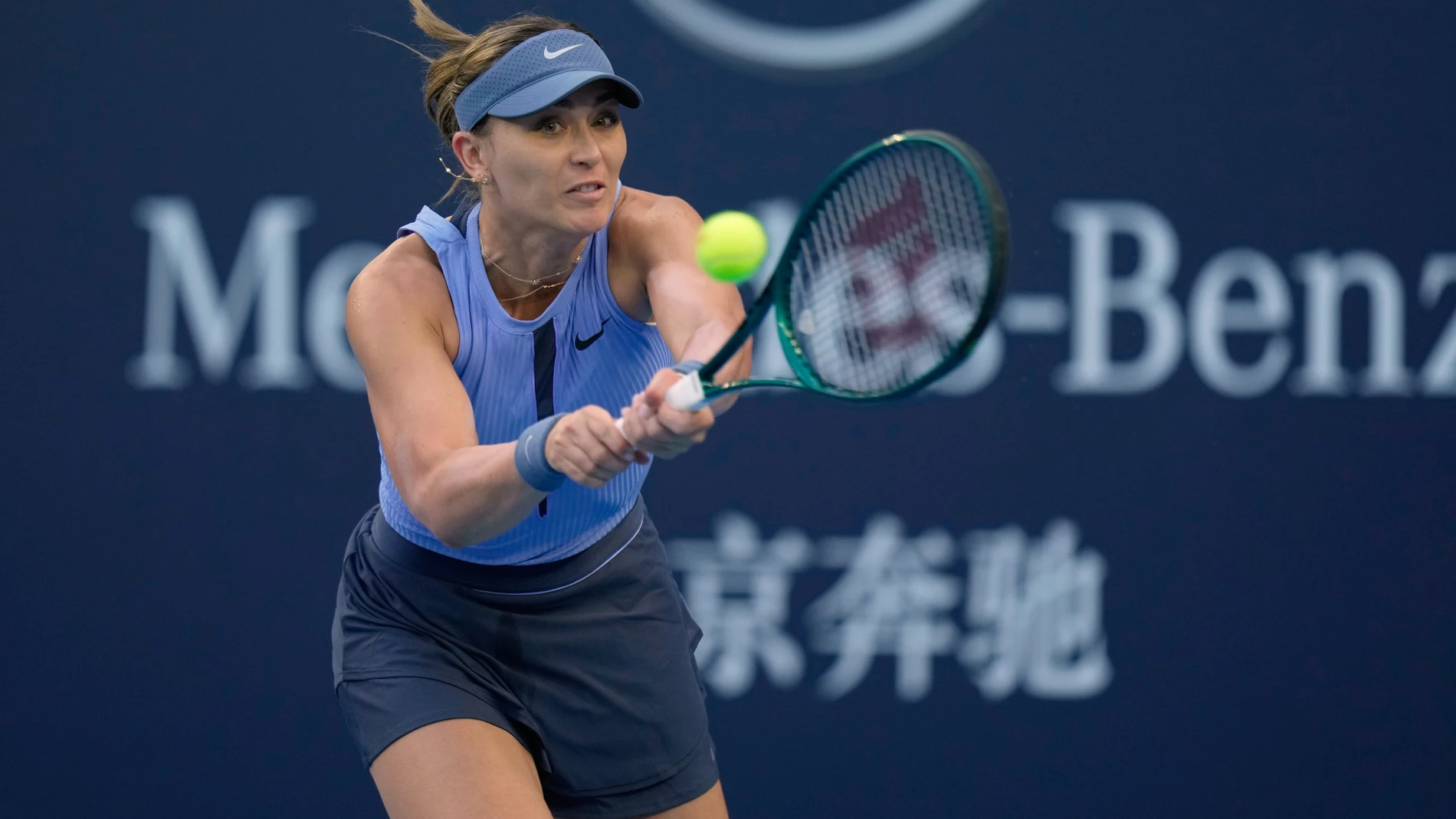 Paula Badosa of Spain plays a backhand return to Karolina Muchova, of the Czech Republic during a women's singles match of the China Open tennis tournament, at the National Tennis Center, in Beijing, China, Sunday, Sept. 28, 2025. (AP Photo/Mahesh Kumar A.)