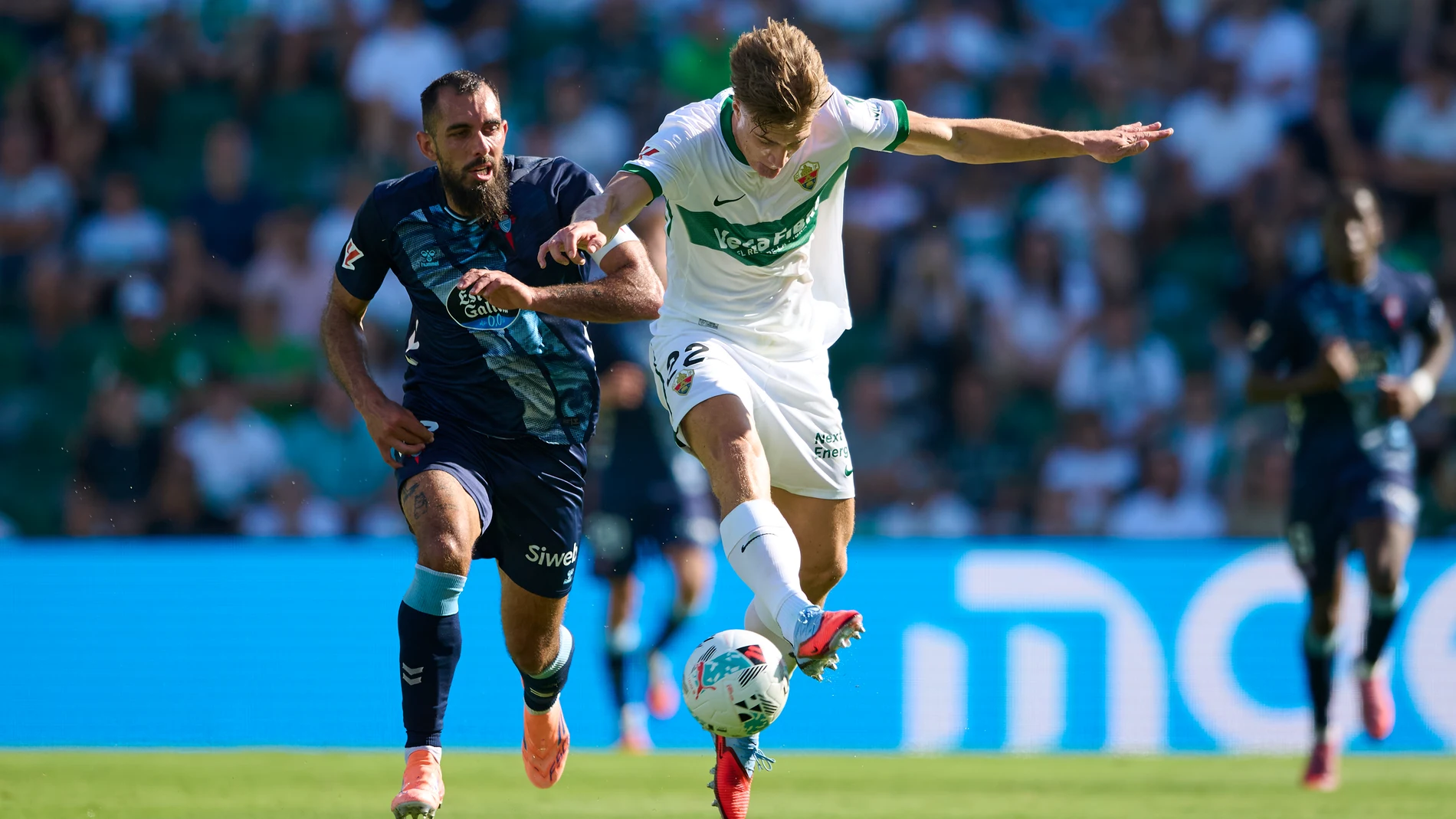 David Affengruber of Elche CF competes for the ball with Borja Iglesias of RC Celta de Vigo during the Spanish League, LaLiga EA Sports, football match played between Elche CF and RC Celta de Vigo at Estadio Manuel Martinez Valero on September 28, 2025 in Elche, Alicante, Spain. AFP7 28/09/2025 ONLY FOR USE IN SPAIN