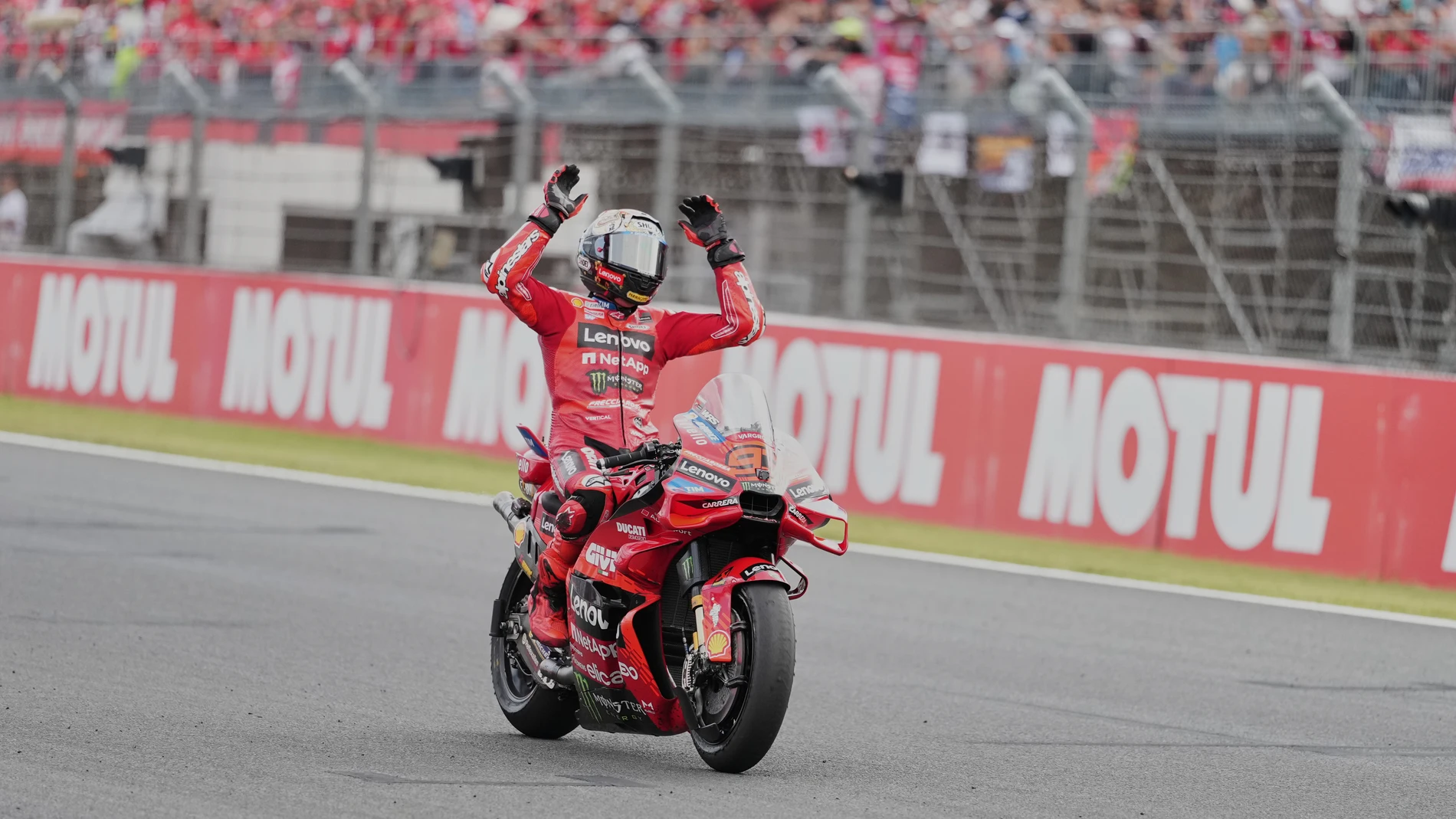 Spanish rider Marc Marquez of Ducati Lenovo Team, celebrates after crossing finishing line during the MotoGP class race of the MotoGP Japanese Grand Prix at the Motegi circuit in Motegi, north of Tokyo, Sunday, Sept. 28, 2025. (AP Photo/Hiro Komae)