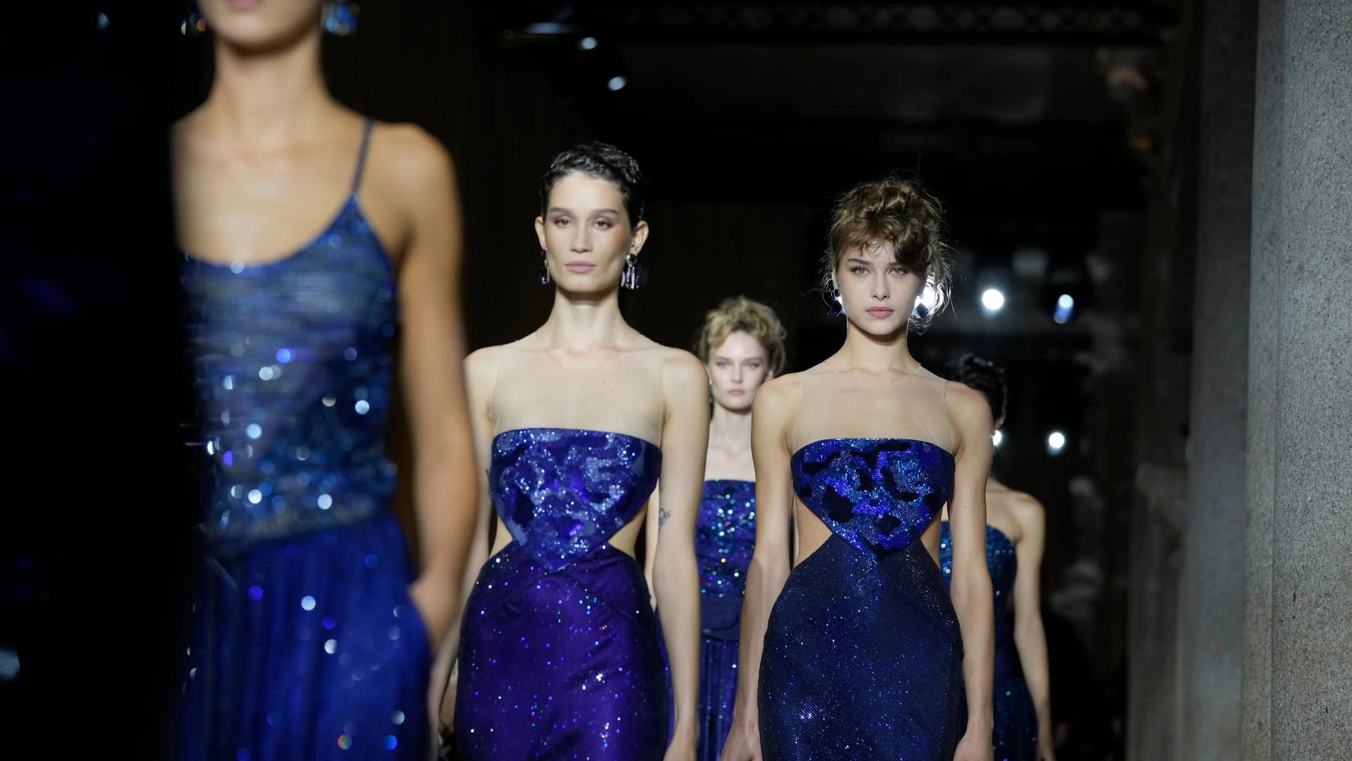 Models wear creations as part of the Giorgio Armani Spring/Summer 2026 collection show in Milan, Italy, Sunday, Sept. 28, 2025. (AP Photo/Luca Bruno)