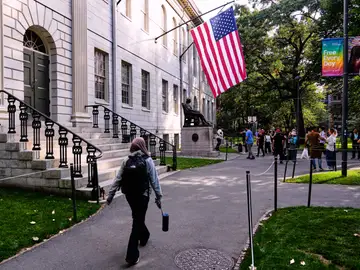Trump Education Harvard A woman walks through Harvard Yard at Harvard University, Tuesday, Sept. 30, 2025, in Cambridge, Mass. (AP Photo/Charles Krupa)