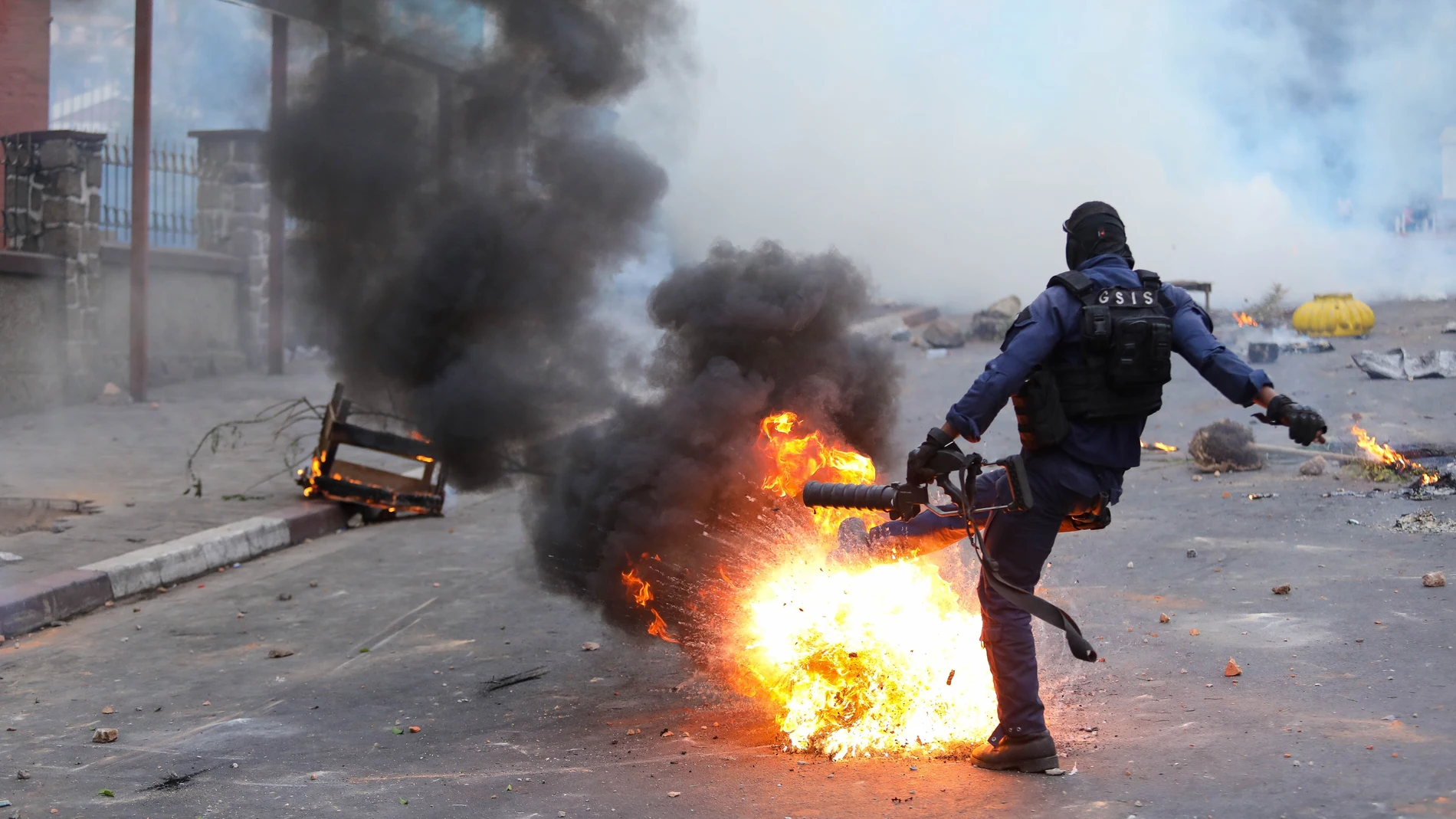 Madagascar police react to protesters demonstrating against chronic electricity and water cuts in Antananarivo, Madagascar, Tuesday, Sept. 30, 2025. (AP Photo/Mamyrael)
