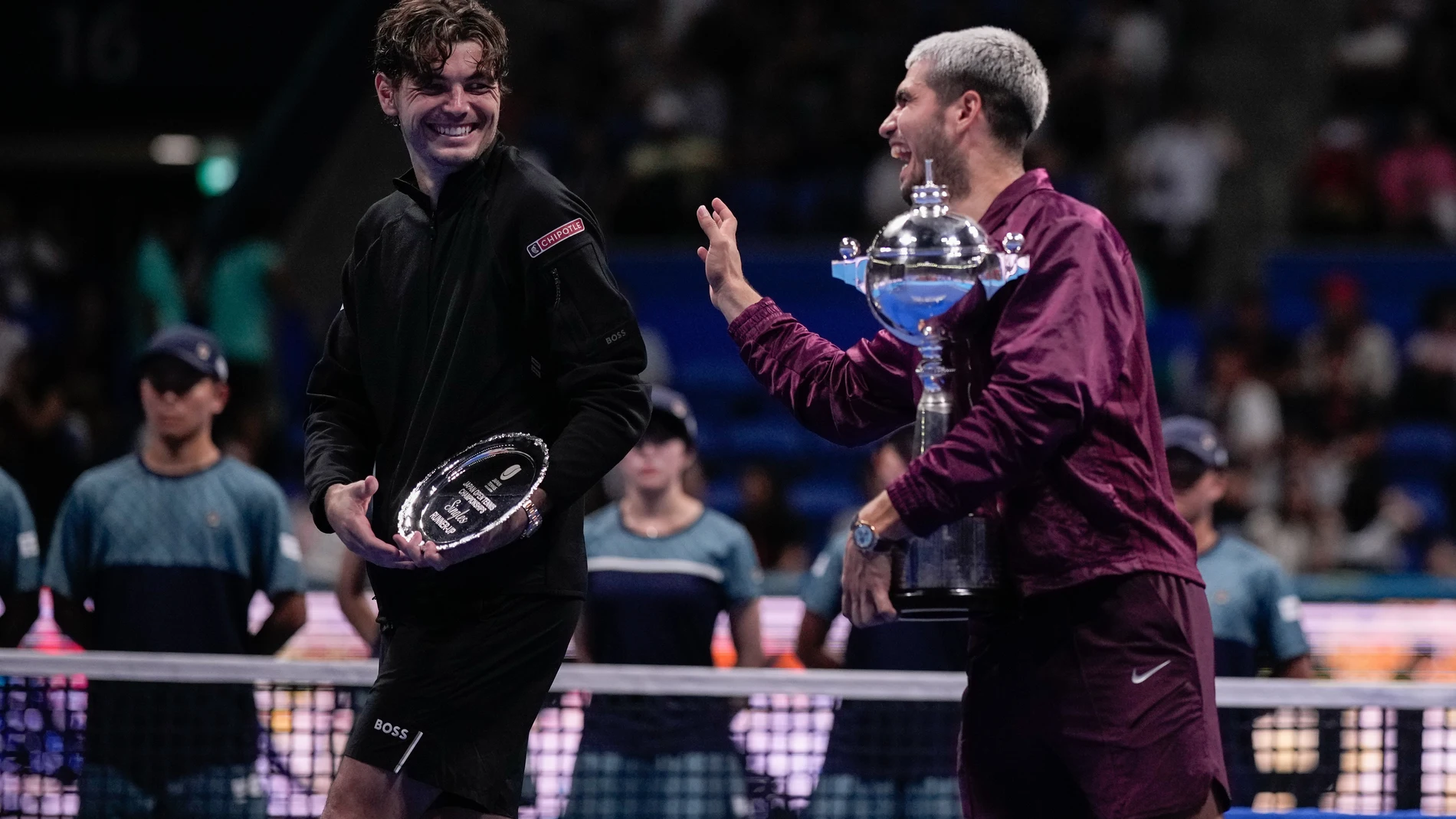 Winner Spain's Carlos Alcaraz, right, share a moment with United States' Taylor Fritz, during medal ceremony after the men's final match at the Tokyo ATP 500 tennis tournament at Ariake Coliseum, in Tokyo, Japan, Tuesday, Sept. 30, 2025. (AP Photo/Louise Delmotte)