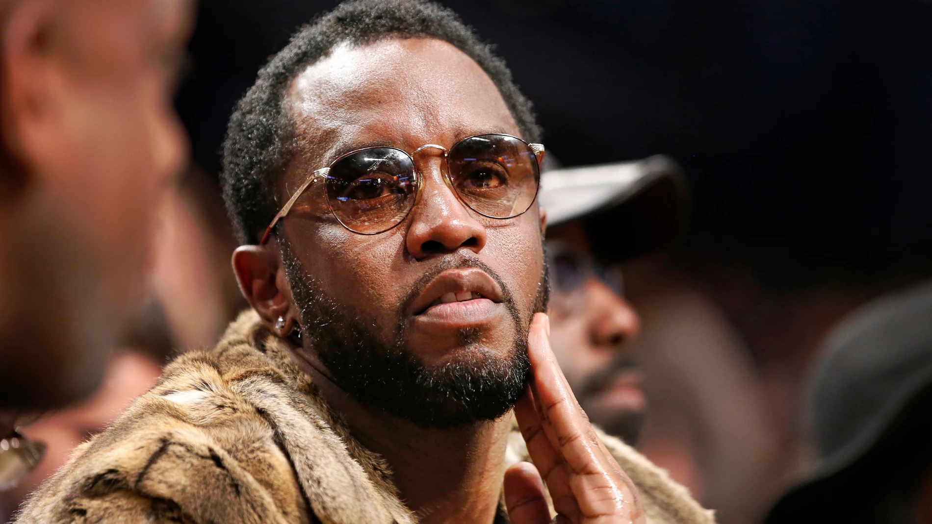 FILE - Sean "Diddy" Combs sits courtside in the second half of an NBA basketball game between the Brooklyn Nets and the New York Knicks, March 12, 2017, in New York. (AP Photo/Kathy Willens, File)