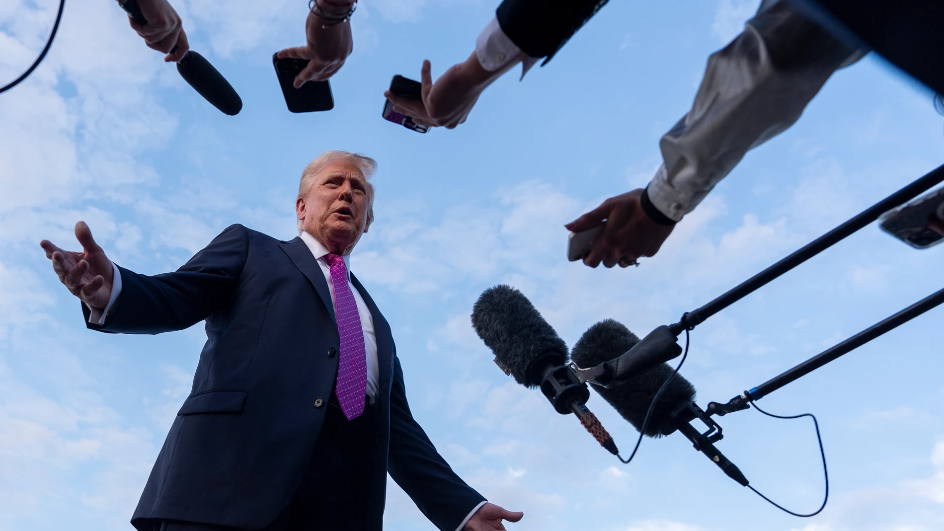 FILE - President Donald Trump speaks with reporters before he departs on Air Force One at Morristown Airport, Sunday, Sept. 14, 2025, in Morristown, N.J. (AP Photo/Alex Brandon, File)
