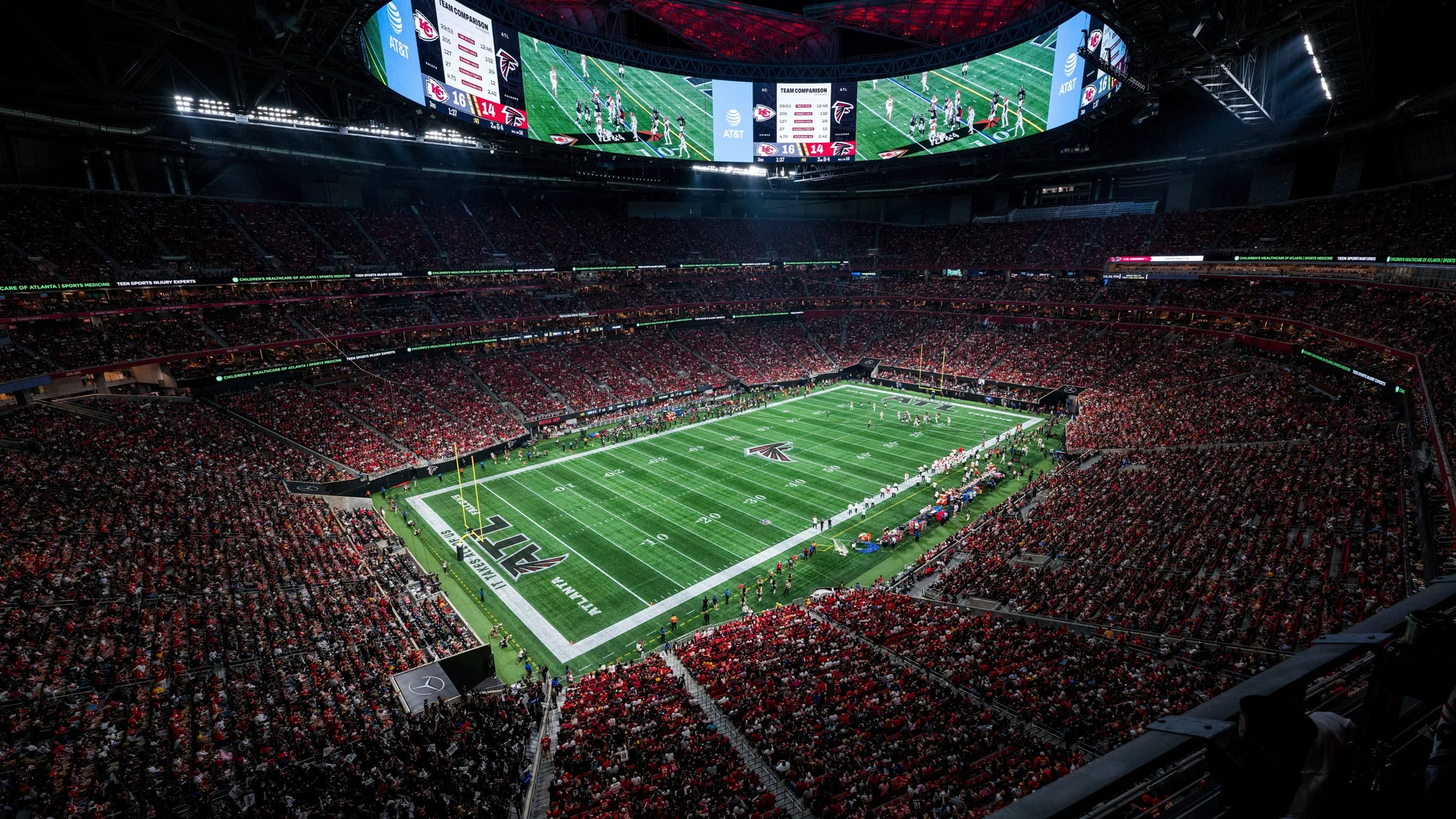 FILE - Fans watch action at the Mercedes-Benz Stadium during an NFL football game between the Atlanta Falcons and the Kansas City Chiefs, Sept. 22, 2024, in Atlanta. (AP Photo/Danny Karnik, File)