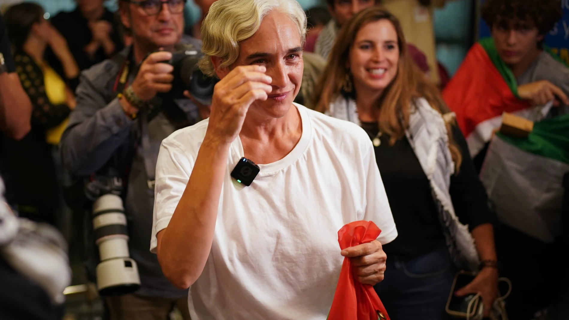 Former Barcelona mayor Ada Colau gets emotional as she arrives at the airport in Barcelona, Spain, Sunday, Oct. 5, 2025, after being arrested on the Global Sumud Flotilla and subsequently released by the Israeli authorities. (AP Photo/Joan Mateu Parra)