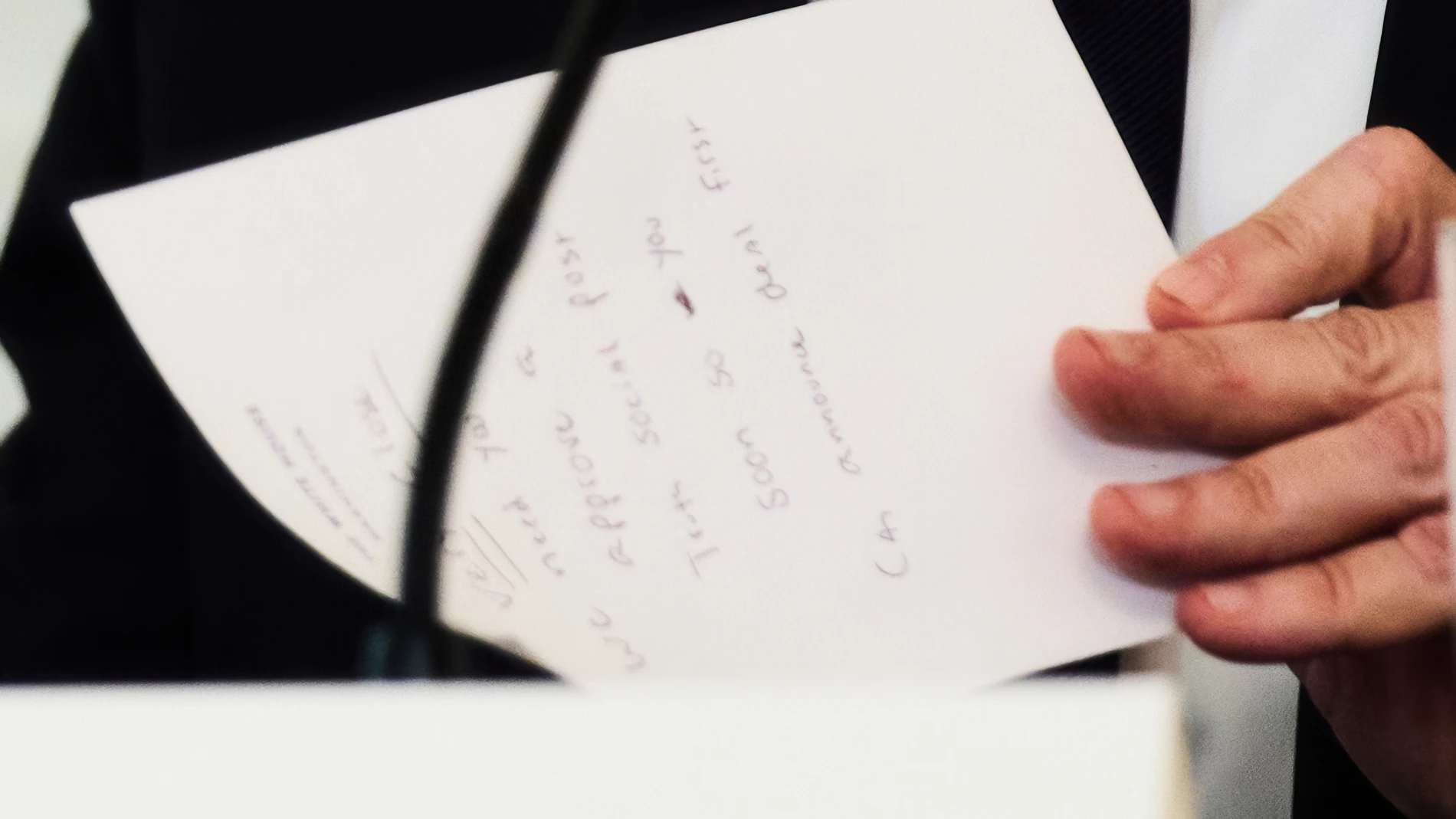 Secretary of State Marco Rubio writes a note before handing it to President Donald Trump during a roundtable meeting on antifa in the State Dining Room at the White House, Wednesday, Oct. 8, 2025, in Washington. (AP Photo/Evan Vucci)