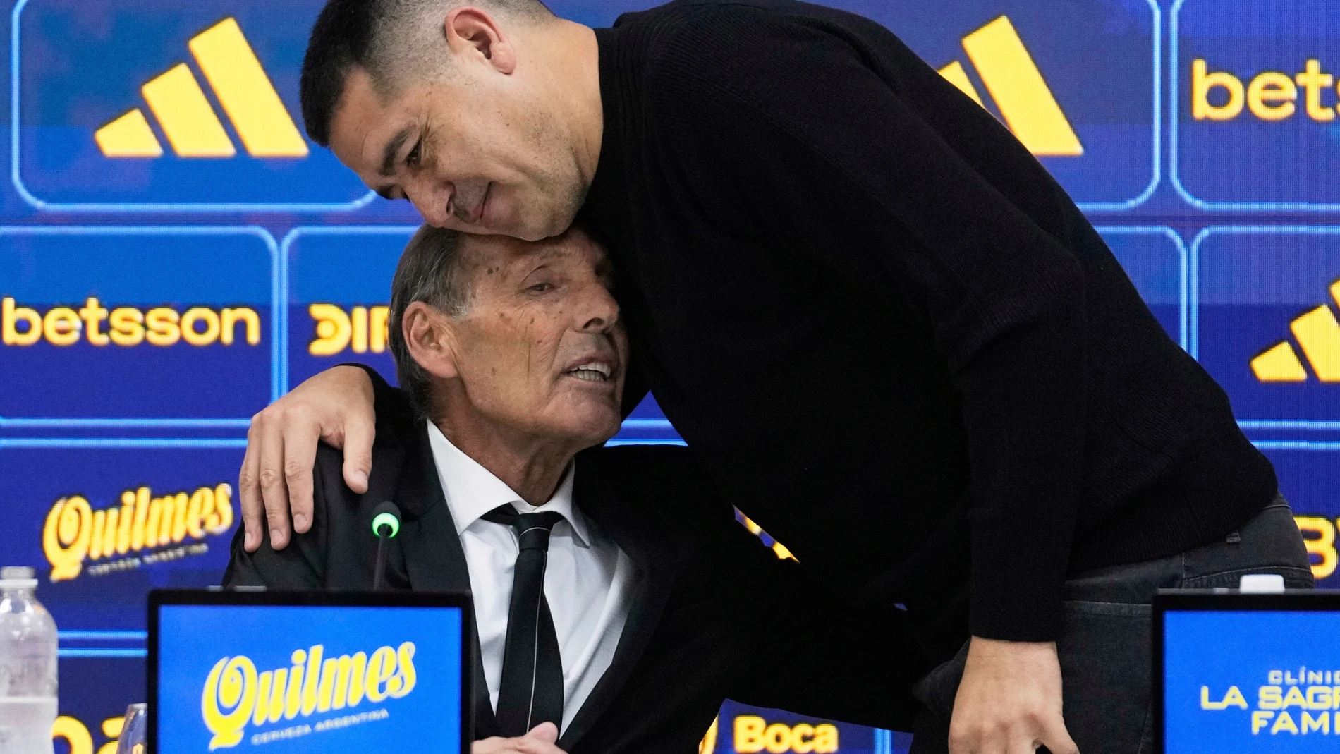 FILE - Boca Juniors President Juan Riquelme, right, embraces new head coach Miguel Angel Russo during his first press conference in Buenos Aires, Argentina, June 2, 2025. (AP Photo/Gustavo Garello, File)