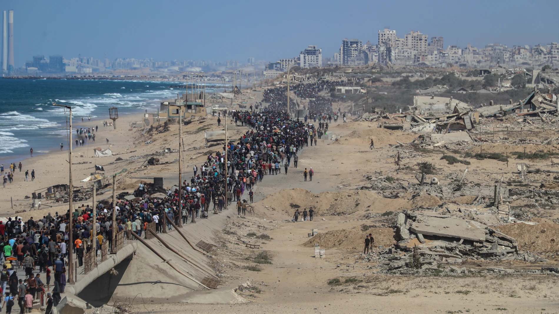 October 10, 2025, Nusairat, Gaza Strip, Palestinian Territory: Palestinians make their way along Al-Rashid road toward Gaza City from Nuseirat in the central Gaza Strip on October 10, 2025. Israeli forces declared a ceasefire and withdrew from some positions in Gaza on October 10, as thousands of displaced Palestinians began to trek home and the families of October 7 hostages awaited news. Israeli prime minister's office said that the government had ''approved the framework'' of a hostage rel...