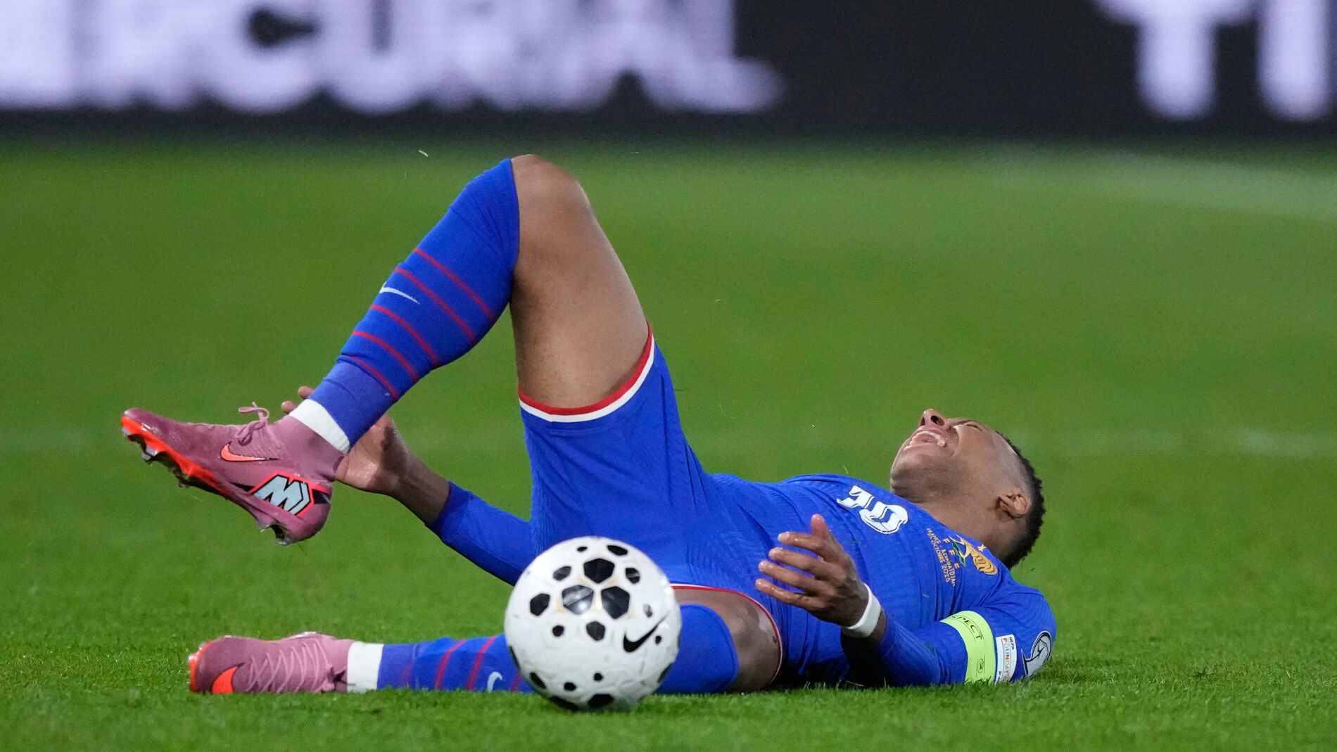 France's Kylian Mbappe grimaces during a World Cup 2026 Group D qualifying soccer match between France and Azerbaijan in Paris, France, on Friday, Oct. 10, 2025. (AP Photo/Michel Euler)