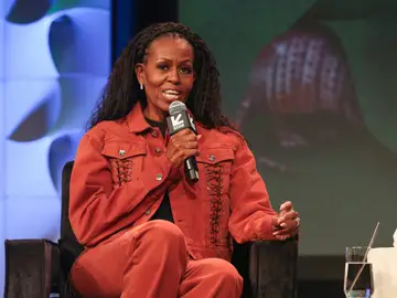 Books-Michelle Obama FILE - Former first lady Michelle Obama takes part in a featured session and taping of her new podcast, IMO, with her brother Craig Robinson, not pictured, at the Austin Convention Center during the South by Southwest Conference and Festival on Thursday, March 13, 2025, in Austin, Texas. (Photo by Jack Plunkett/Invision/AP, File)