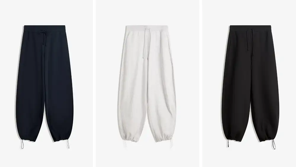 Pantalón de felpa barrel de Bershka (25,99€), con bajo regulable y dos largos a elegir —regular o petite—, disponible en gris, negro y azul marino.