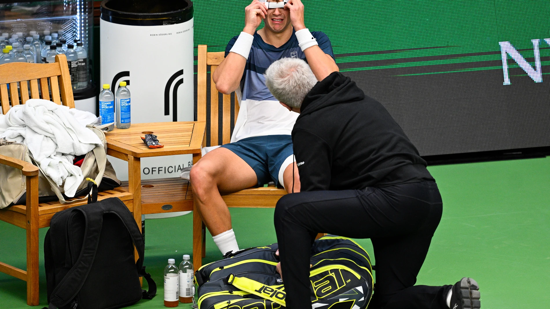 Denmark's Holger Rune injures his foot during the men's singles semifinal tennis match against France's Ugo Humbert at the BNP Paribas Nordic Open tennis tournament in Stockholm, Sweden, Saturday, Oct. 18, 2025. (Anders Wiklund/TT via AP)