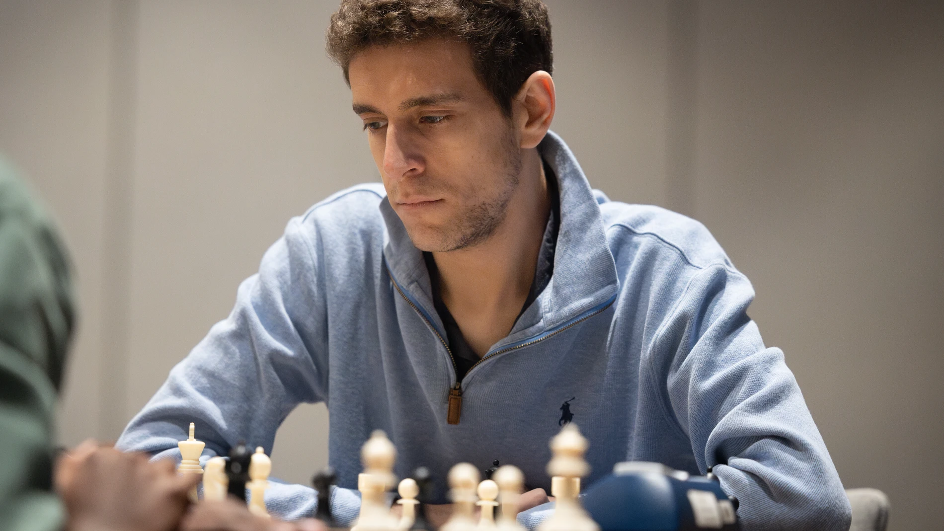 This undated photo released by Charlotte Chess Center shows Daniel Naroditsky playing chess on the board. (Kelly Centrelli/Charlotte Chess Center via AP