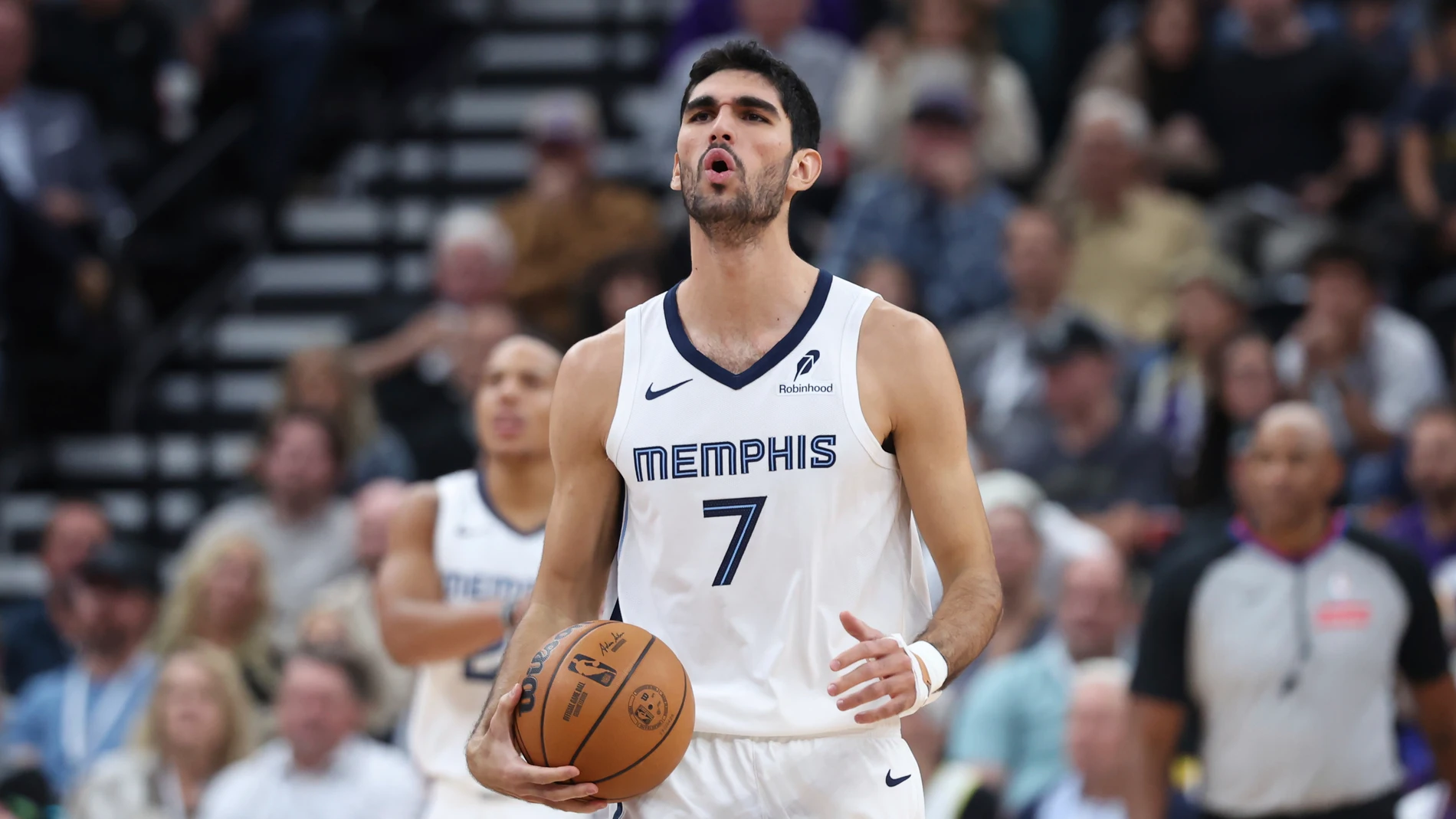 Memphis Grizzlies forward Santi Aldama (7) reacts to a play against the Utah Jazz during the first half of an NBA basketball game, Wednesday, Oct. 23, 2024, in Salt Lake City.