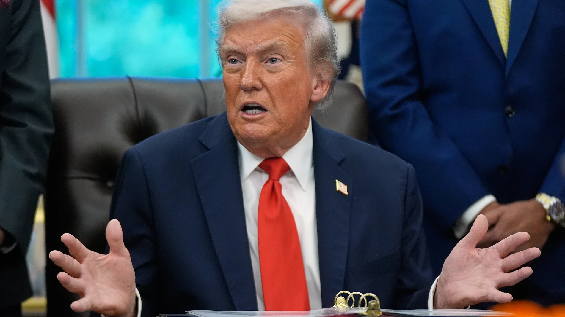 President Donald Trump answers questions from reporters during a Diwali celebration in the Oval Office at the White House, Tuesday, Oct. 21, 2025, in Washington. (AP Photo/Manuel Balce Ceneta)