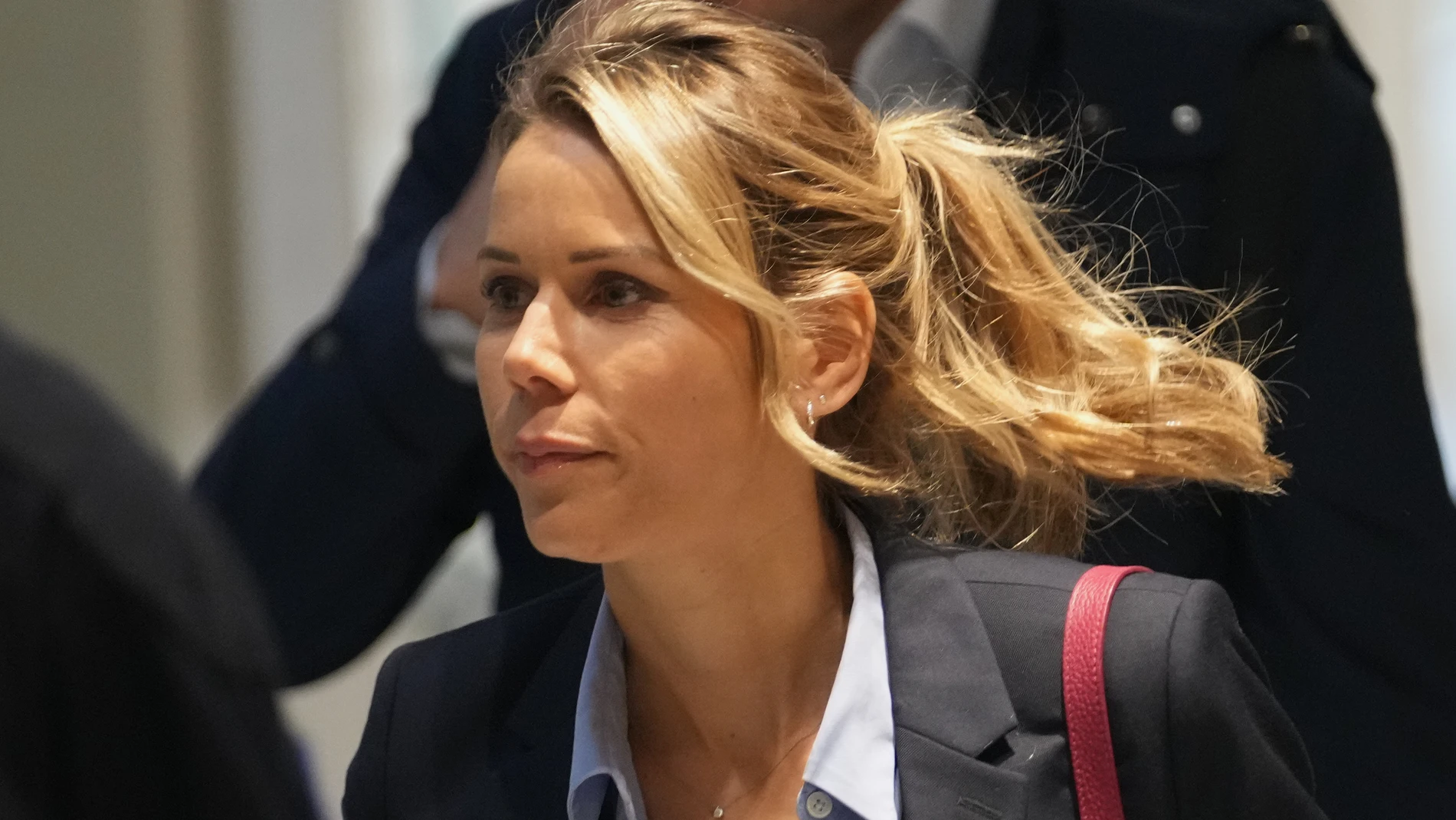 Tiphaine Auziere, daughter of Brigitte Macron, arrives as a courtroom as ten people go on trial accused of cyberbullying Brigitte Macron after they allegedly made "malicious" comments online spreading claims that President Emmanuel Macron's wife is a man, Tuesday, Oct. 28, 2025 in Paris. (AP Photo/Christophe Ena)