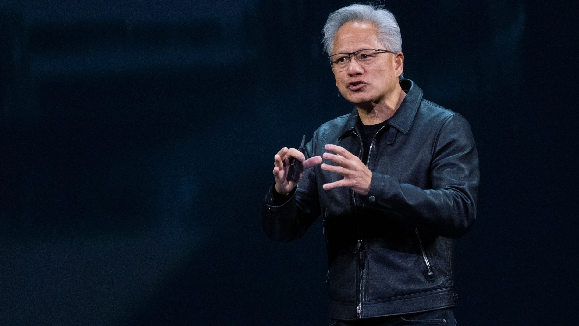 NVIDIA CEO Jensen Huang speaks on how AI infrastructure and AI factories that generate intelligence at scale are powering a new industrial revolution, at Washington Convention Center, Tuesday, Oct. 28, 2025, in Washington. (AP Photo/Manuel Balce Ceneta)