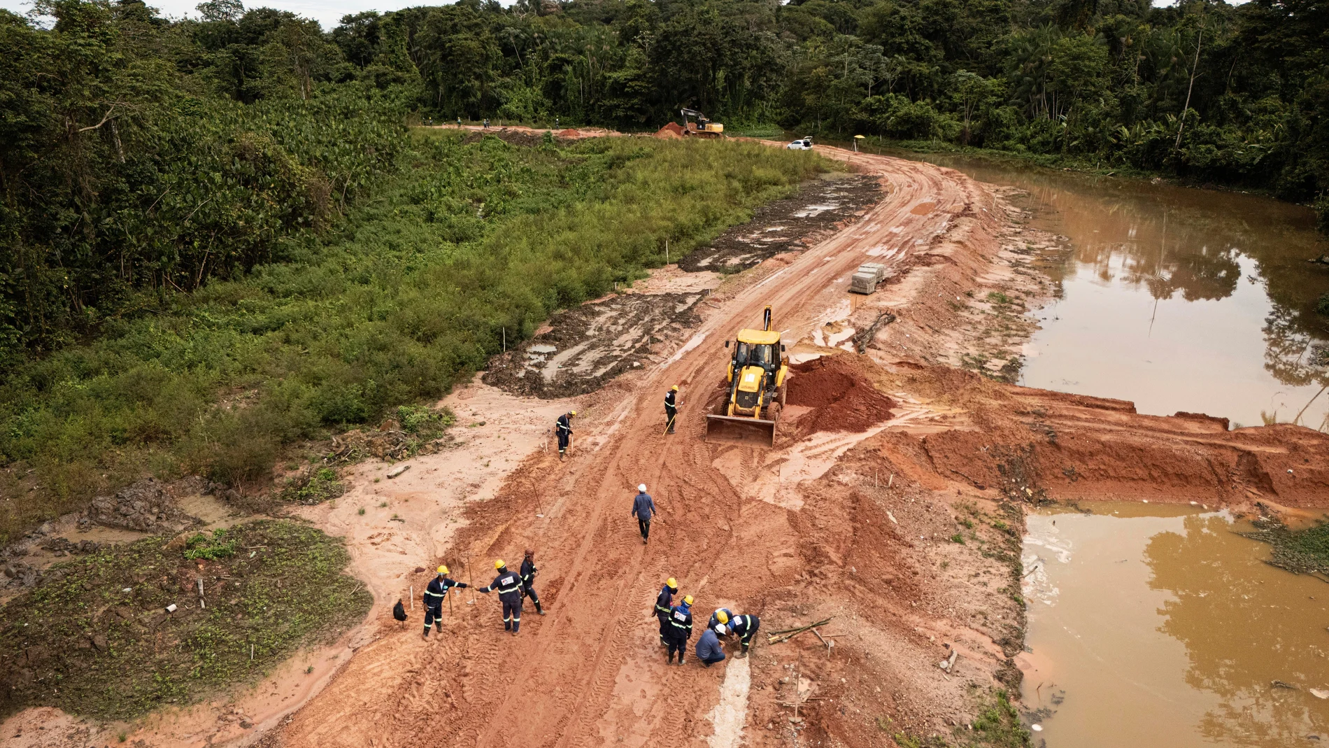 FILE - Workers construct an avenue, named Liberdade, or Freedom, ahead of the COP30 U.N. Climate Summit in Belem, Brazil, March 18, 2025. (AP Photo/Jorge Saenz, File)