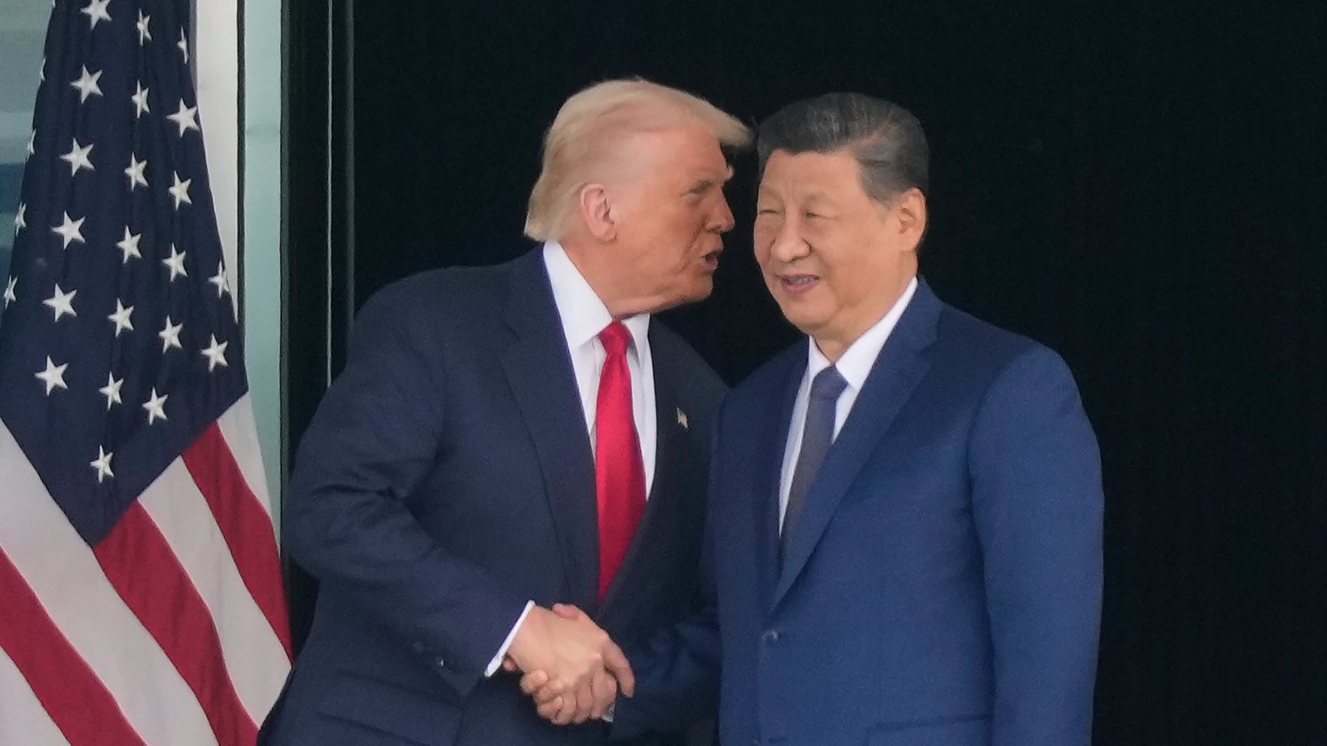President Donald Trump, left, and Chinese President Xi Jinping, right, shake hands after their U.S.-Chin summit meeting at Gimhae International Airport Jinping in Busan, South Korea, Thursday, Oct. 30, 2025. (AP Photo/Mark Schiefelbein)