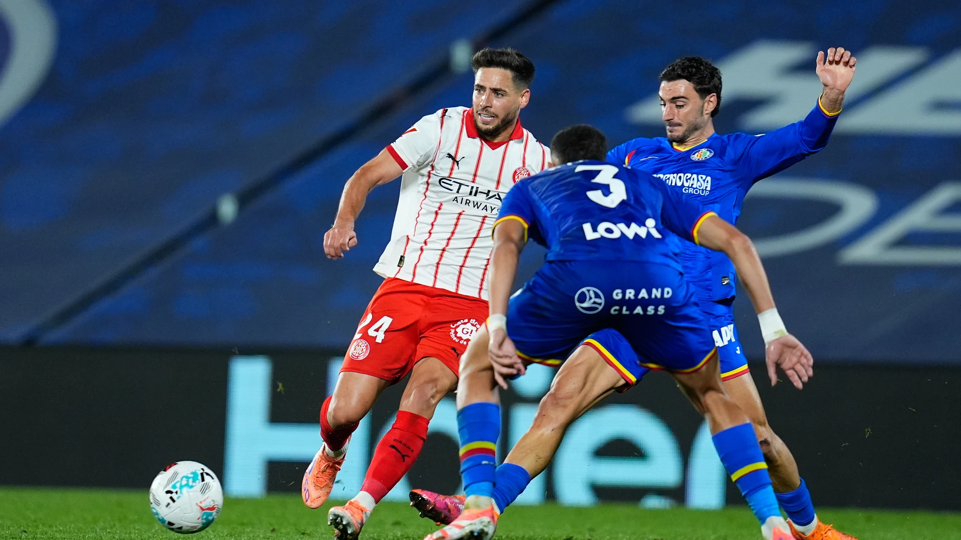 Alex Moreno of Girona FC and Juan Iglesias of Getafe CF compete for the ball during the Spanish League, LaLiga EA Sports, football match played between Getafe CF and Girona FC at Coliseum de Getafe stadium on October 31, 2025, in Getafe, Spain. AFP7 31/10/2025 ONLY FOR USE IN SPAIN