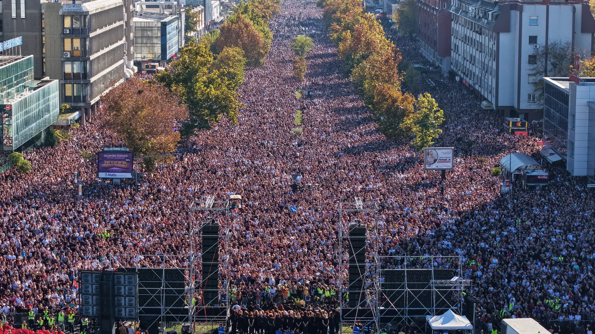 People fill the streets near the train station before observing 16 minutes of silence for the victims on the first anniversary of the disaster that killed 16 people, in Novi Sad, Serbia, Saturday, Nov. 1, 2025. (AP Photo/Armin Durgut)