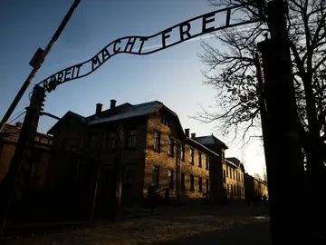 Halloween Float Auschwitz Gate FILE - The sun lights the buildings behind the entrance of the former Nazi death camp Auschwitz-Birkenau in Oswiecim, Germany, Dec. 6, 2019. (Photo/Markus Schreiber, File)