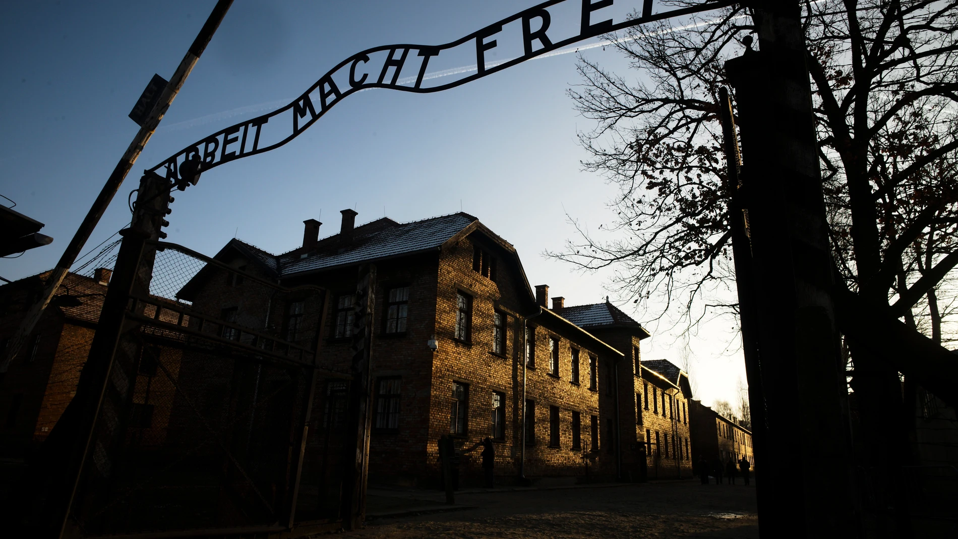 FILE - The sun lights the buildings behind the entrance of the former Nazi death camp Auschwitz-Birkenau in Oswiecim, Germany, Dec. 6, 2019. (Photo/Markus Schreiber, File)