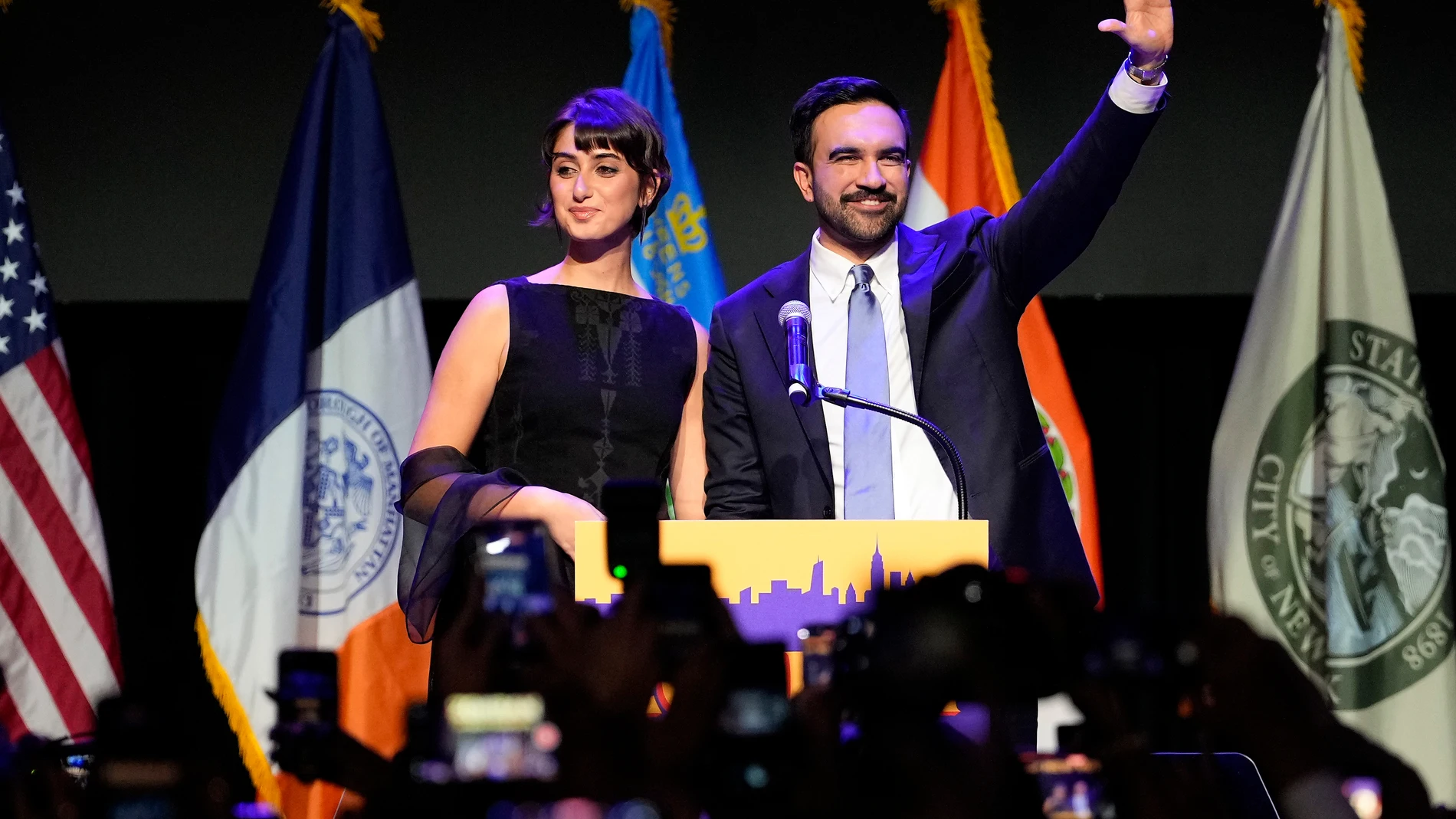 Mayor elect Zohran Mamdani, right, and his wife Rama Duwaji react to supporters during an election night watch party, Tuesday, Nov. 4, 2025, in New York. (AP Photo/Yuki Iwamura)