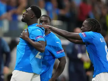 Cyprus Soccer Champions League Pafos' Derrick Luckassen, left, celebrates with teammates after scoring the opening goal of his team during the Champions League opening phase soccer match between Pafos FC and Villarreal CF in Limassol, Cyprus, Wednesday, Nov. 4, 2025. (AP Photo/Petros Karadjias)