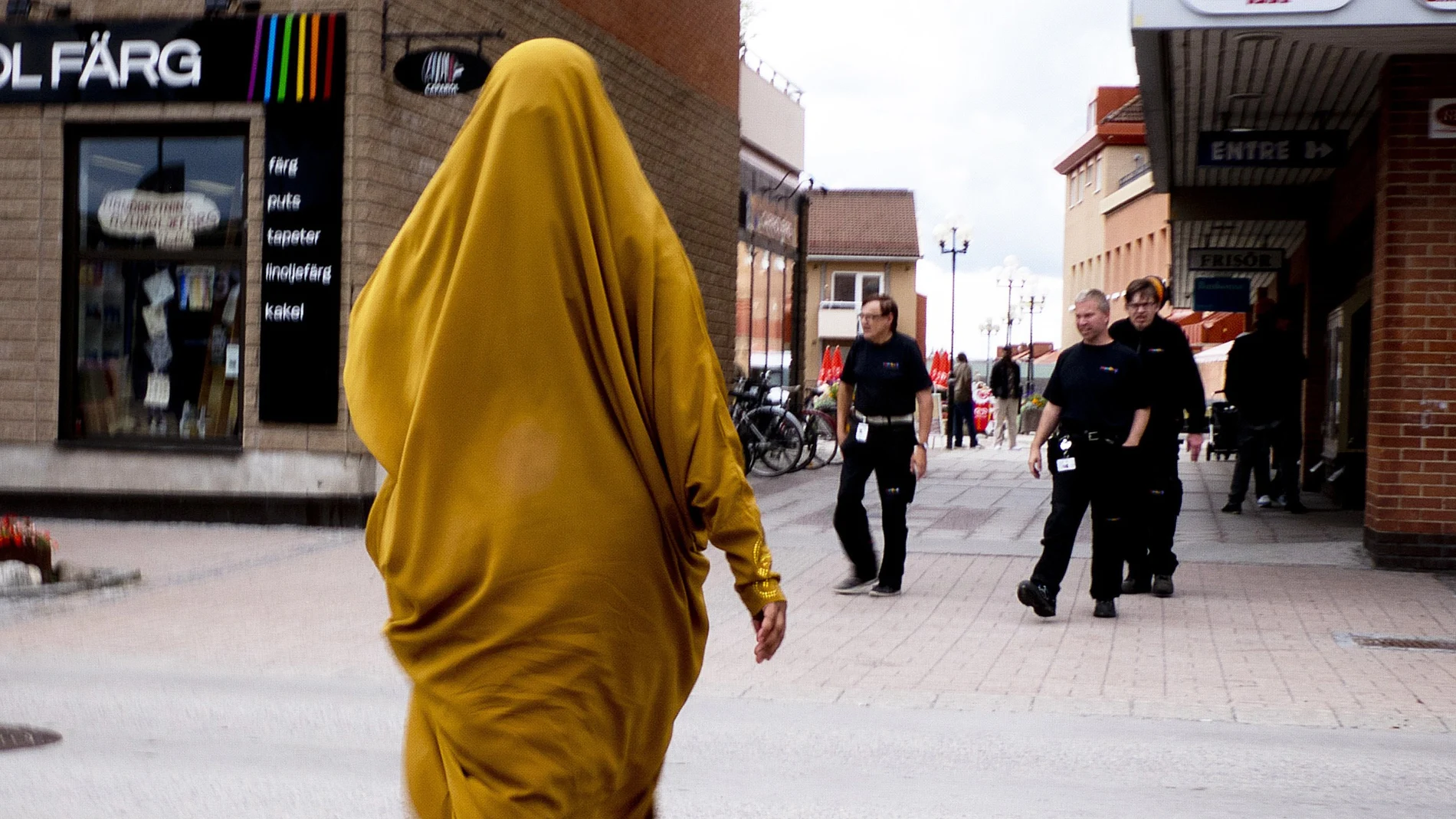 A migrant from Somalia walks through downtown Flen, some 100 km west of Stockholm, Sweden.