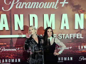 Germany Landman Actors Ali Larter, left, and Demi Moore pose during the premiere of the Paramount series "Landman" in Berlin, Germany, Friday, Nov. 14, 2025. (AP Photo/Ebrahim Noroozi)