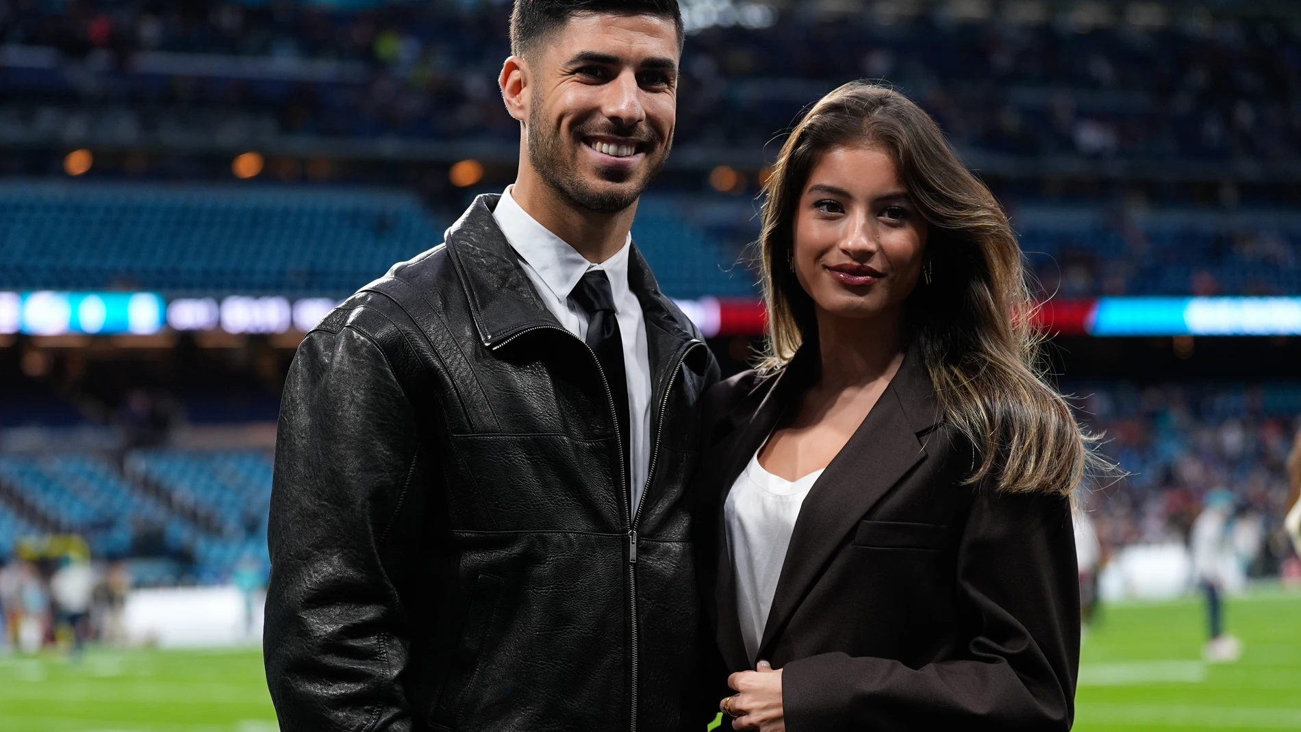 Marco Asensio and Lavinia Leon pose for the photo during the National Football League (NFL) 2025 Madrid Game, match played between Miami Dolphins and Washington Commanders at Santiago Bernabeu stadium on November 16, 2025, in Madrid, Spain. AFP7 16/11/2025 ONLY FOR USE IN SPAIN