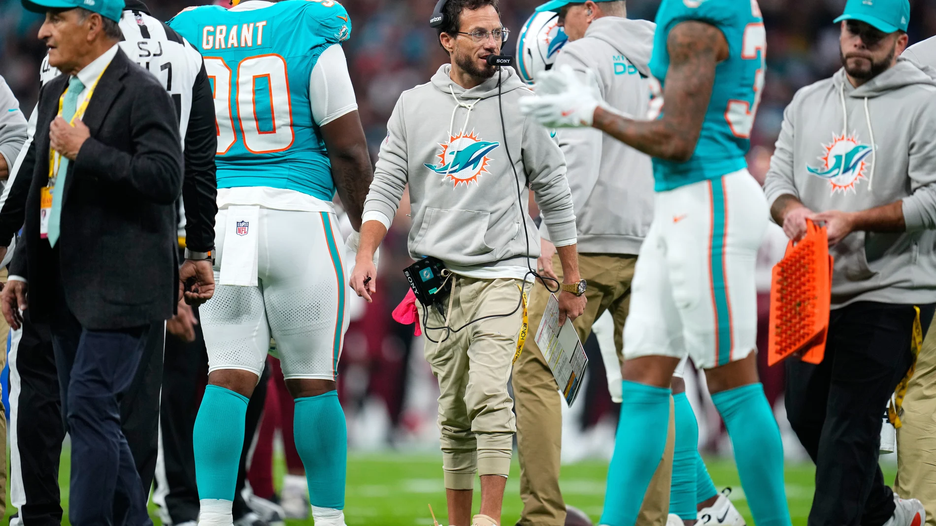 Miami Dolphins head coach Mike McDaniel stands on the touchline during the first half of an NFL football game between the Washington Commanders and the Miami Dolphins in Madrid, Spain, Sunday, Nov. 16, 2025. (AP Photo/Manu Fernandez)