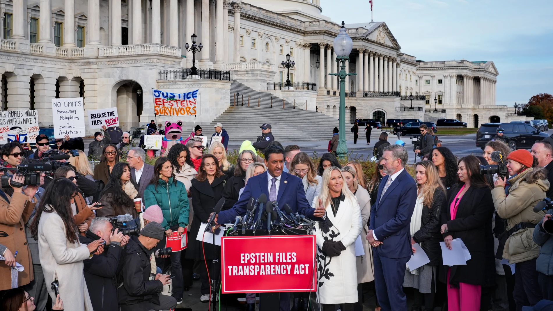From left, Rep. Ro Khanna, D-Calif., at podium, Rep. Marjorie Taylor-Greene, R-Ga., and Rep. Thomas Massie, R-Ky., speak during a news conference as the House prepares to vote on the Epstein Files Transparency Act, at the Capitol in Washington, Tuesday, Nov. 18, 2025. They are joined by survivors and family members who recounted their personal stories of Epstein. (AP Photo/J. Scott Applewhite)