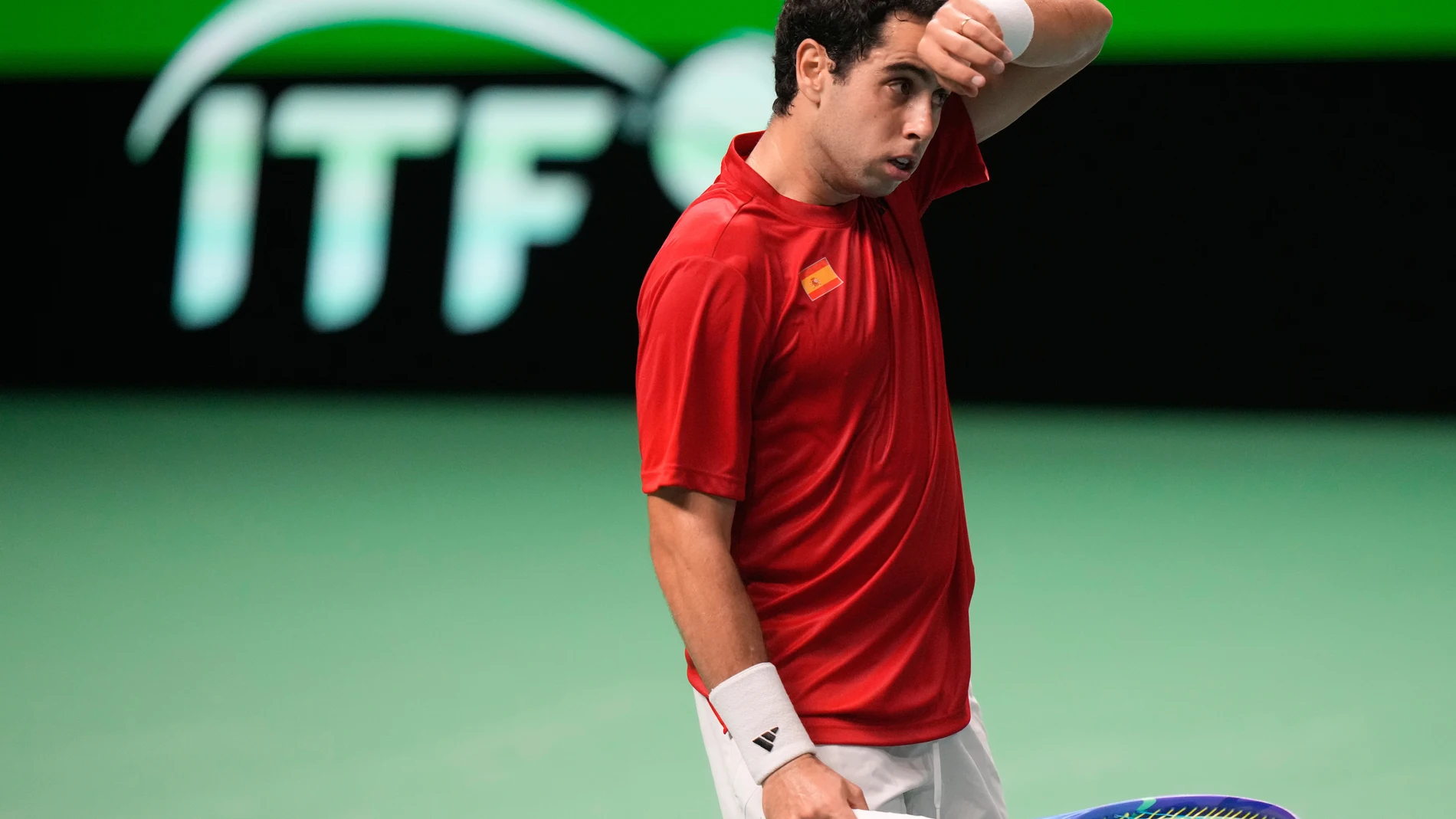 Spain's Jaume Munar reacts during a Davis Cup final singles tennis match against Italy's Flavio Cobolli, in Bologna, Italy, Sunday, Nov. 23, 2025. (AP Photo/Luca Bruno)