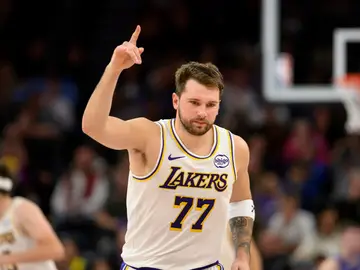 Lakers Jazz Basketball Los Angeles Lakers guard Luka Doncic reacts to a made three-point shot during the second half of an NBA basketball game against the Utah Jazz, Sunday, Nov. 23, 2025, in Salt Lake City. (AP Photo/Tyler Tate)